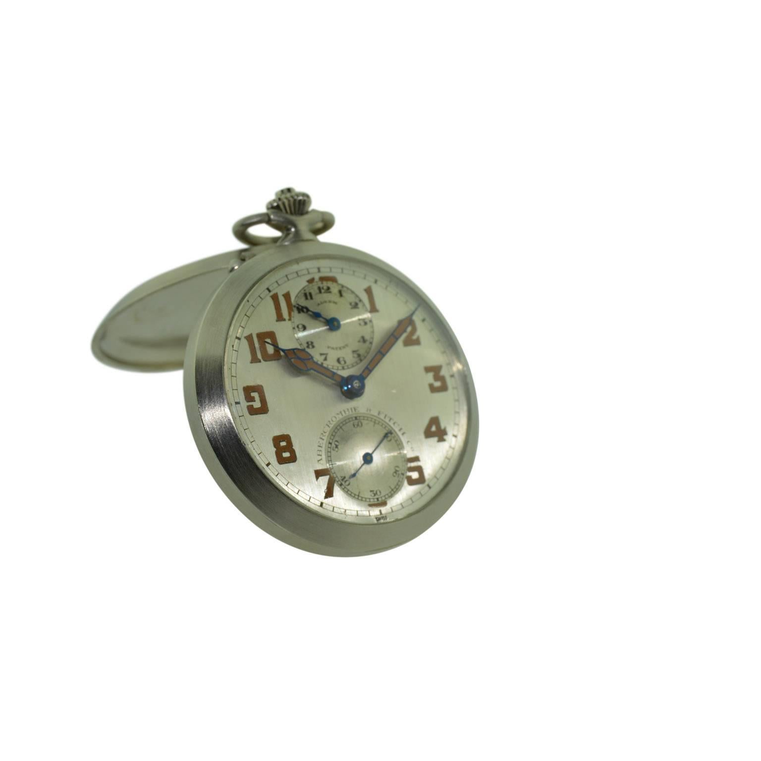 FACTORY / HOUSE: Concord for Abercrombie and Fitch
STYLE / REFERENCE: Art Deco / Open Faced Pocket Alarm Watch
METAL / MATERIAL: Nickel Silver
DIMENSIONS: 49mm Diameter
CIRCA YEAR: 1930's
MOVEMENT / CALIBER: Manual Winding / 17 Jewels 
DIAL / HANDS: