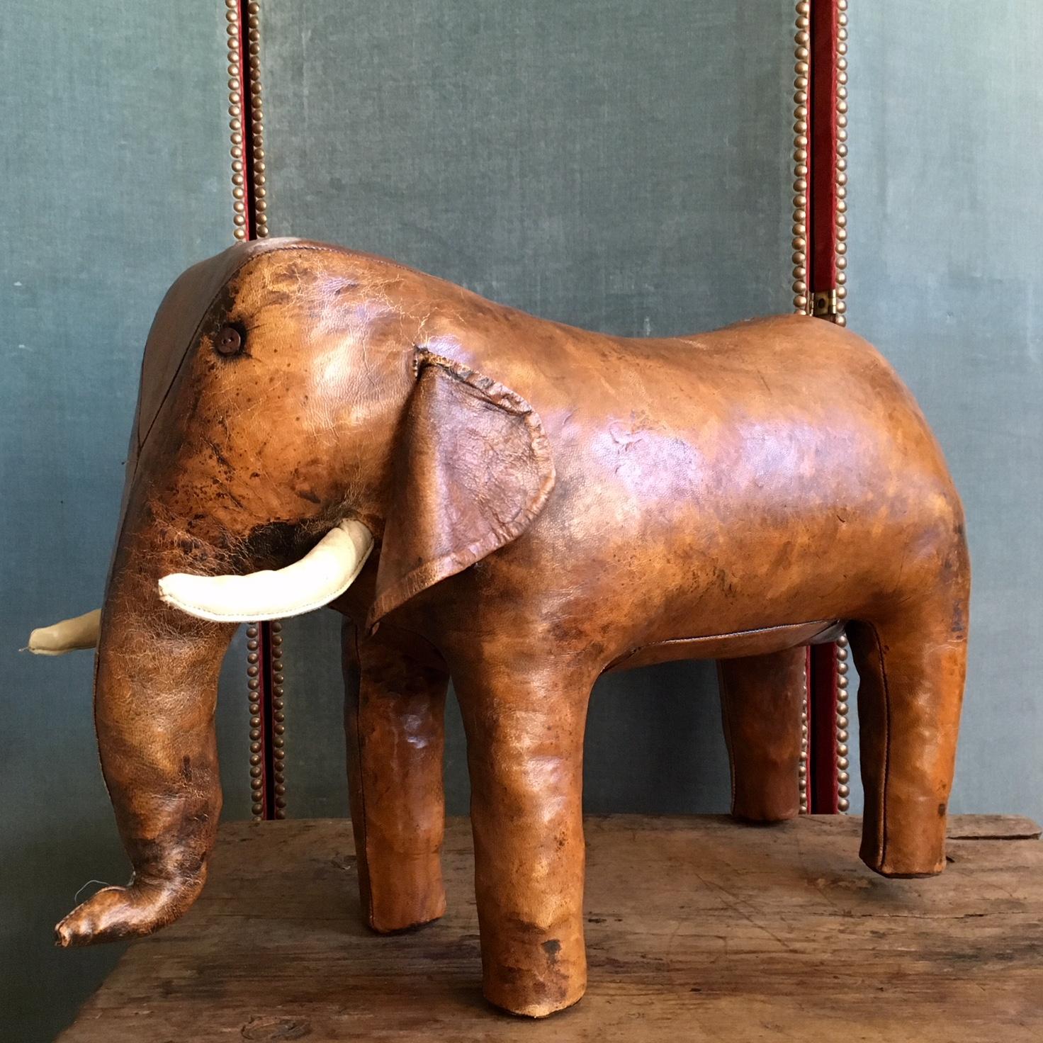 Abercrombie & Fitch vintage leather footstool in the shape of an elephant. This footstool was made in the 60s and the design is by Dimitri Omersa. A special collector's item. The leather shows traces of aging, such as discoloration and small cracks,