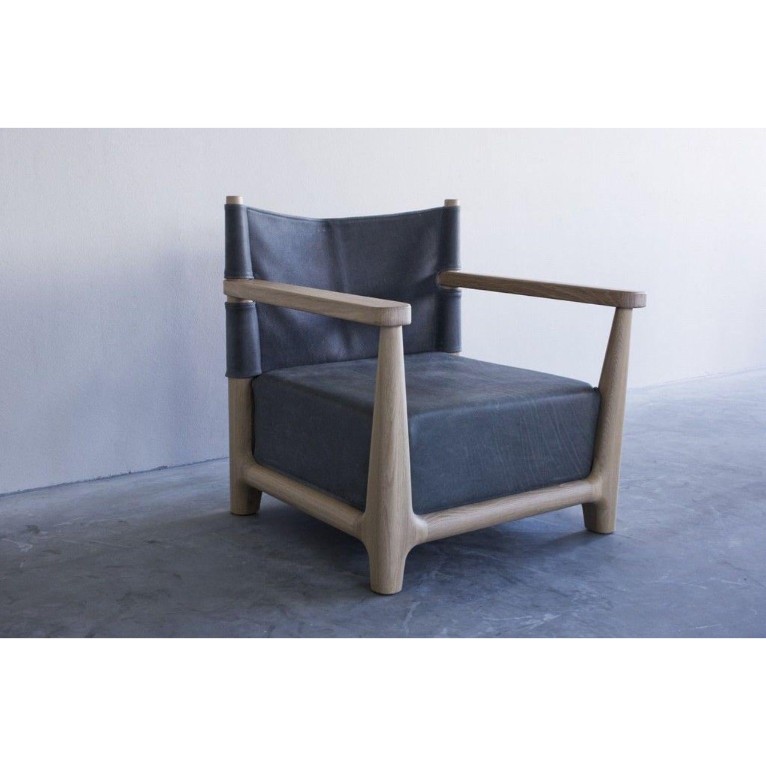 Abi Fauteuil by Van Rossum
Dimensions: D77 x W67 x H76 cm
Materials: Oak, leather.

The wood is available in all standard Van Rossum colors, or in a matching finish to customer’s own sample.
Choose from our leather colors, or send us your own
