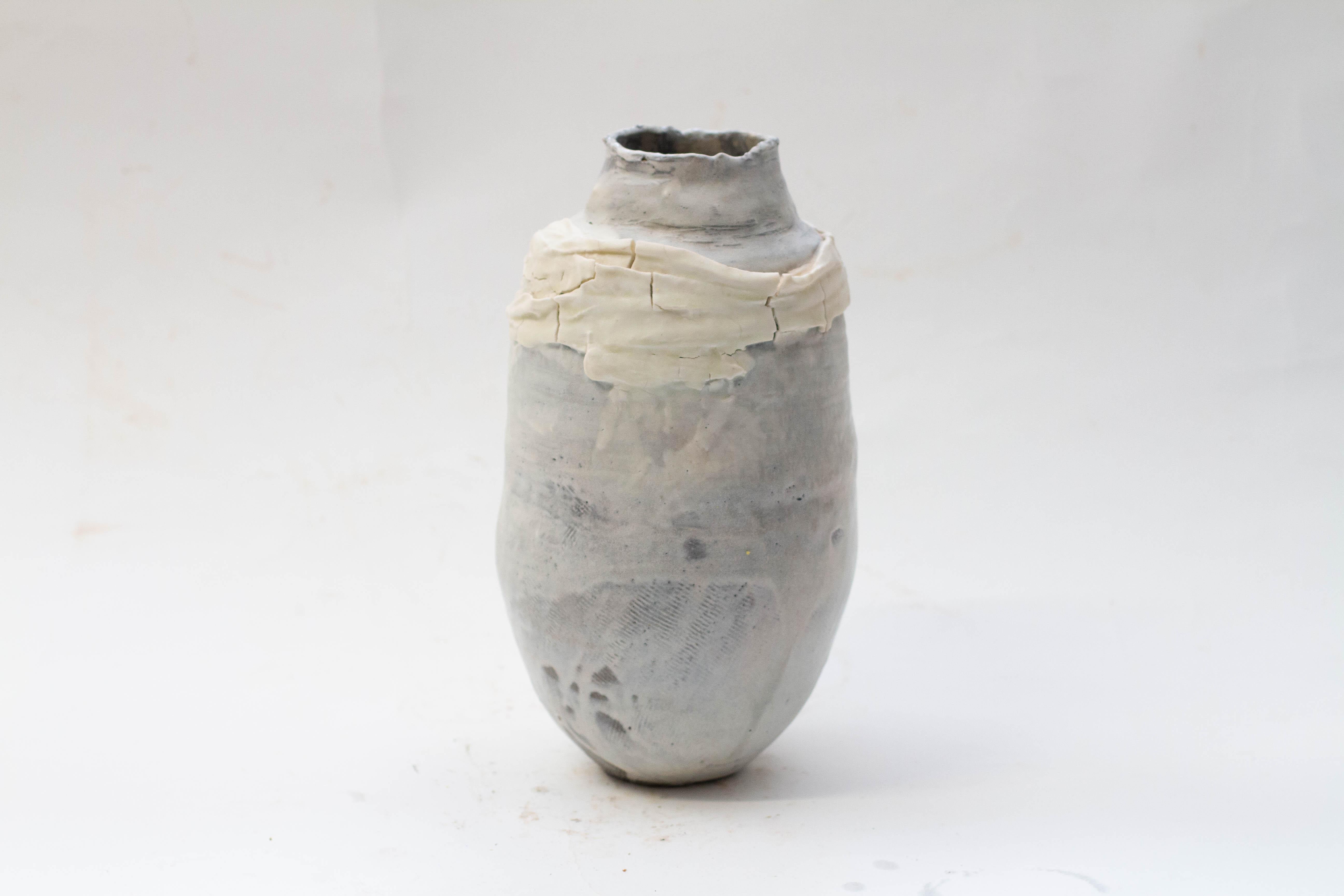 Three wheel thrown vessels altered by hand, in anthracite grey clay, washed with porcelain and garlanded with veils of porcelain. This trio was conceived at the start of lockdown. My work usually starts from an anthropomorphic perspective, in