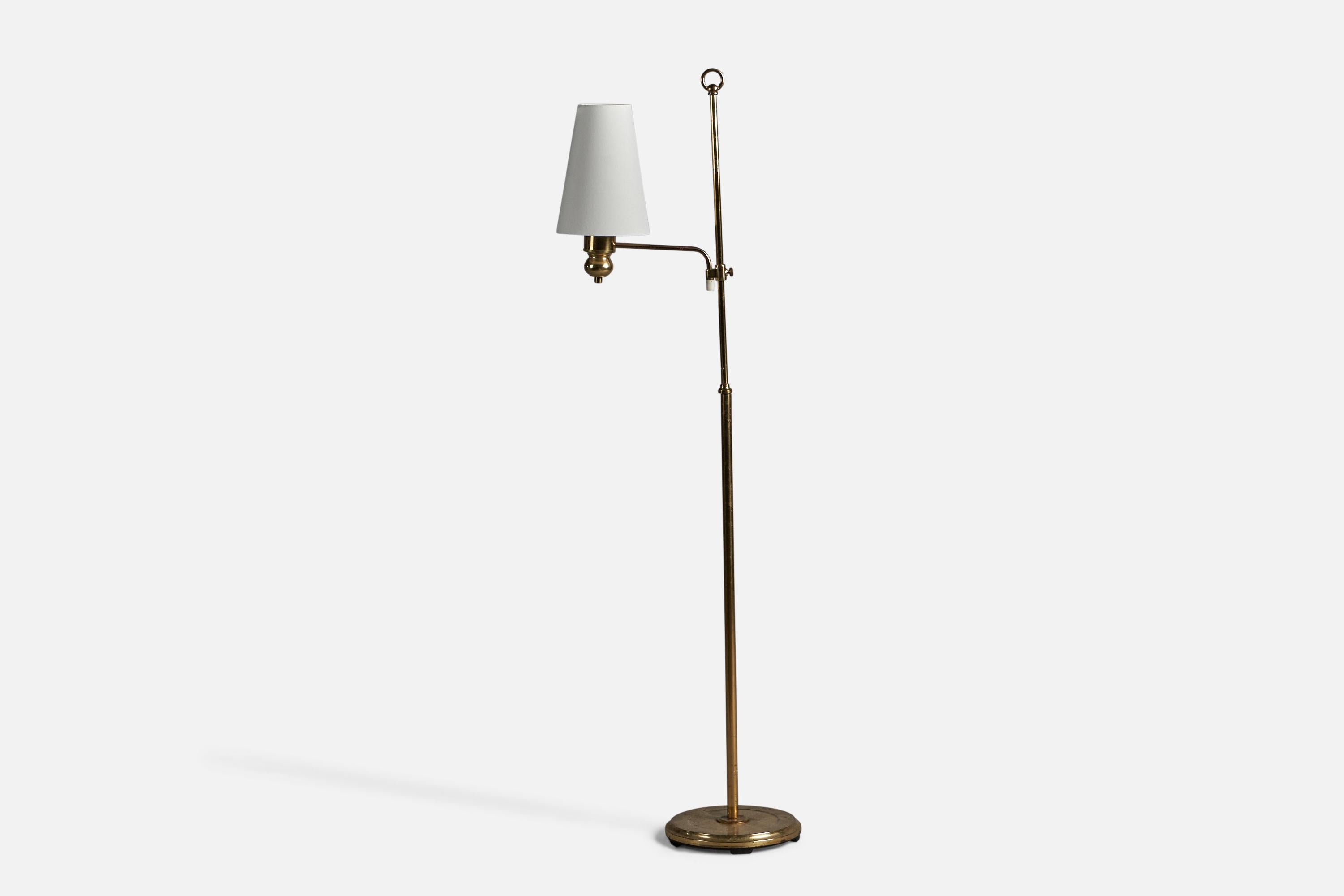 An adjustable brass and white fabric floor lamp, designed and produced by Abo Randers, Denmark, c. 1960s.

Overall Dimensions (inches): 53