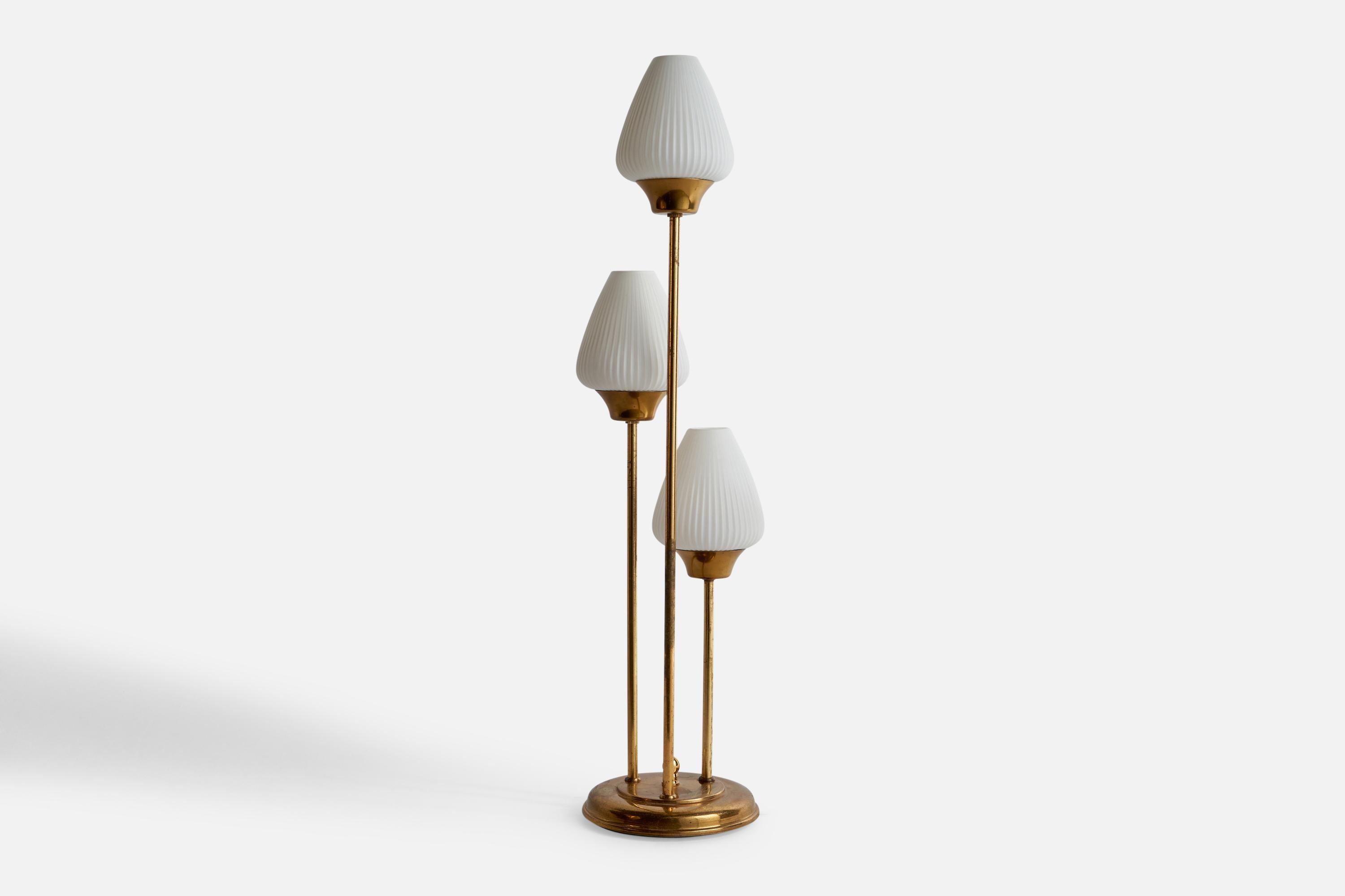 A three-armed brass and opaline glass table lamp designed and produced by Abo Randers, Denmark, 1970s.

Overall Dimensions (inches): 26.38” H x 6.4” W x 6.4” D
Bulb Specifications: E-26 Bulb
Number of Sockets: 3
All lighting will be converted for US