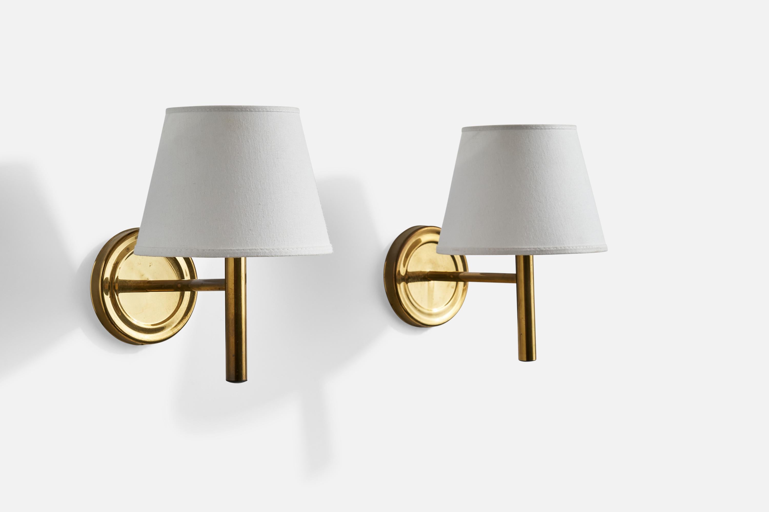 A pair of brass and white fabric wall lights designed and produced by Abo Randers, Denmark, c. 1960s.