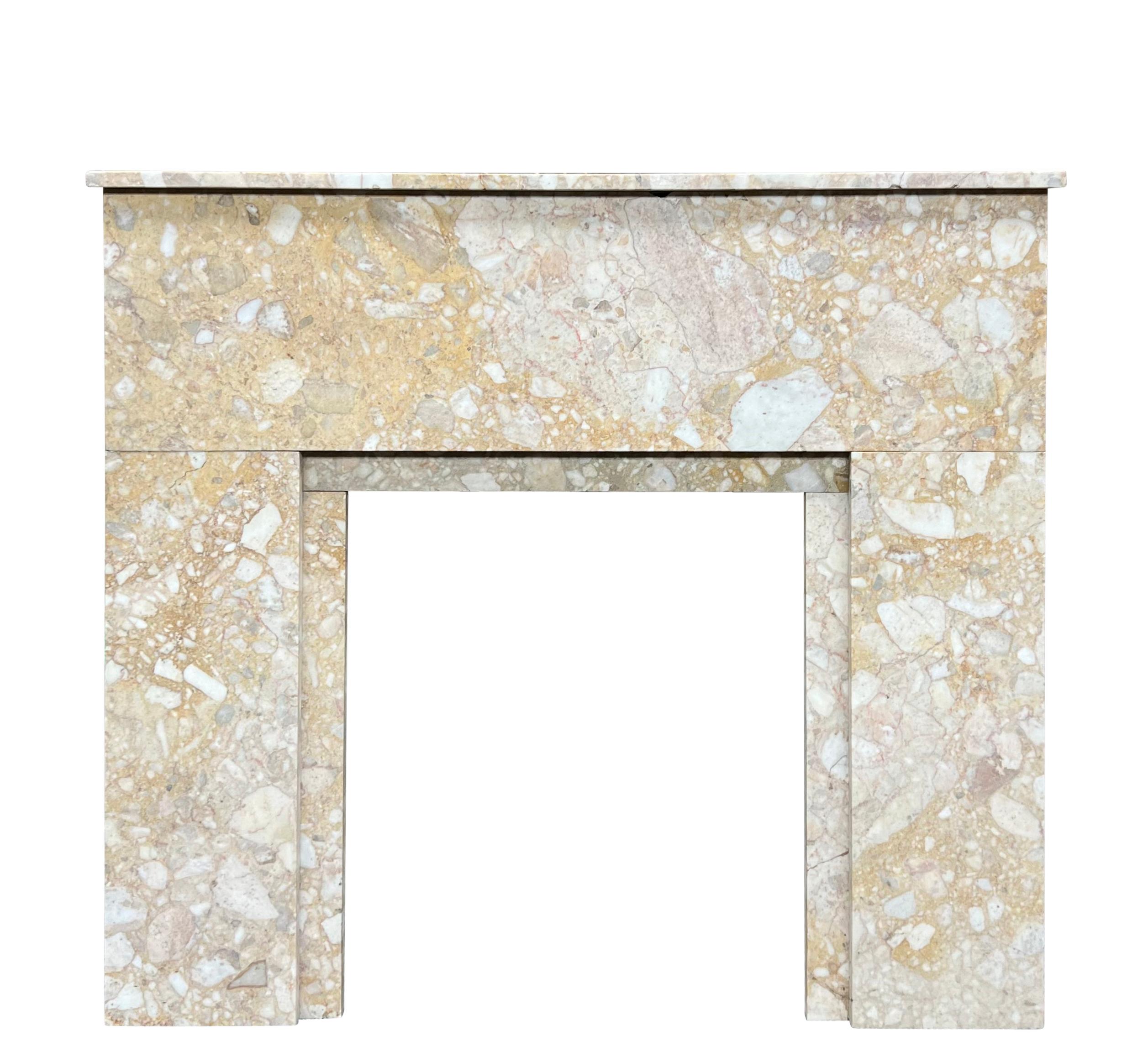 This is a fine vintage Art deco period fireplace surround. The Brêche marble is a one of a kind type of marble that is supporting to the mantle. some veins are reinforced on the tablet. The fireplace surround was installed in Parisian apartment on