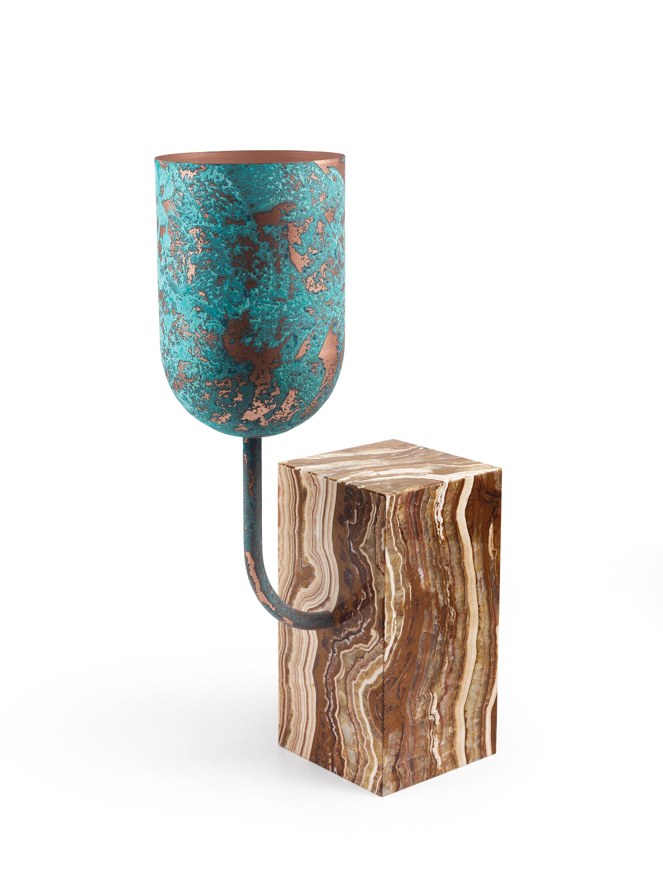 Aboram tall vase by Sam Baron
Materials: Base in marble (Onice sultano, Dolce Vita or Irish Green), body in natural copper or with vert-de-gris finish.
Dimensions: 70cm x 30cm x 18cm

From a geometric sharply cut block of exquisite stone comes