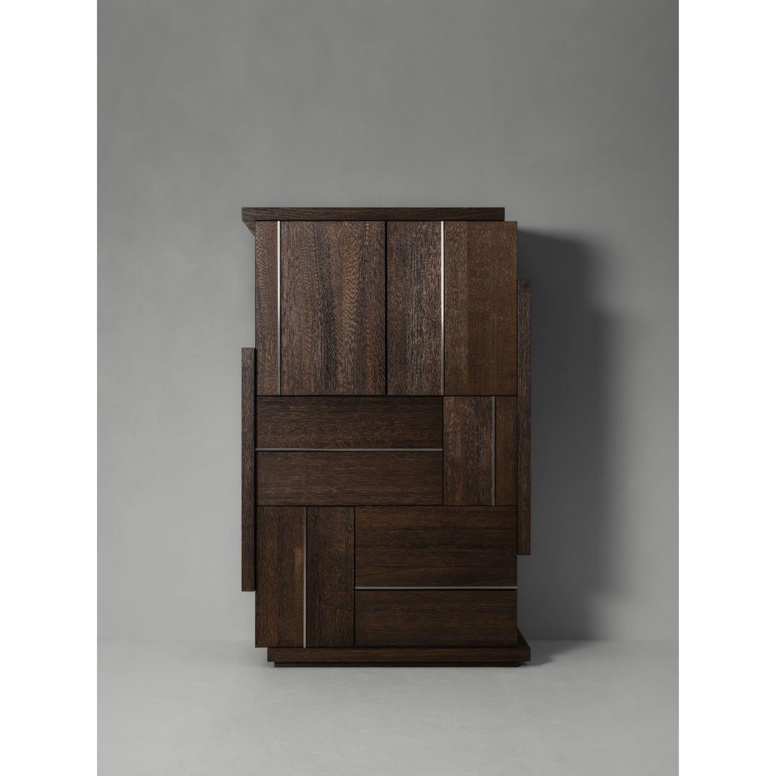 Abqji Cabinet by Van Rossum
Dimensions: D 132 x W 57 x H 210 cm
Materials: Stainless Steel, Brass, Oak, Grey Pepper Brushed
Available in different materials and colours. Please contact us.

A cabinet with a bold and balanced design featuring