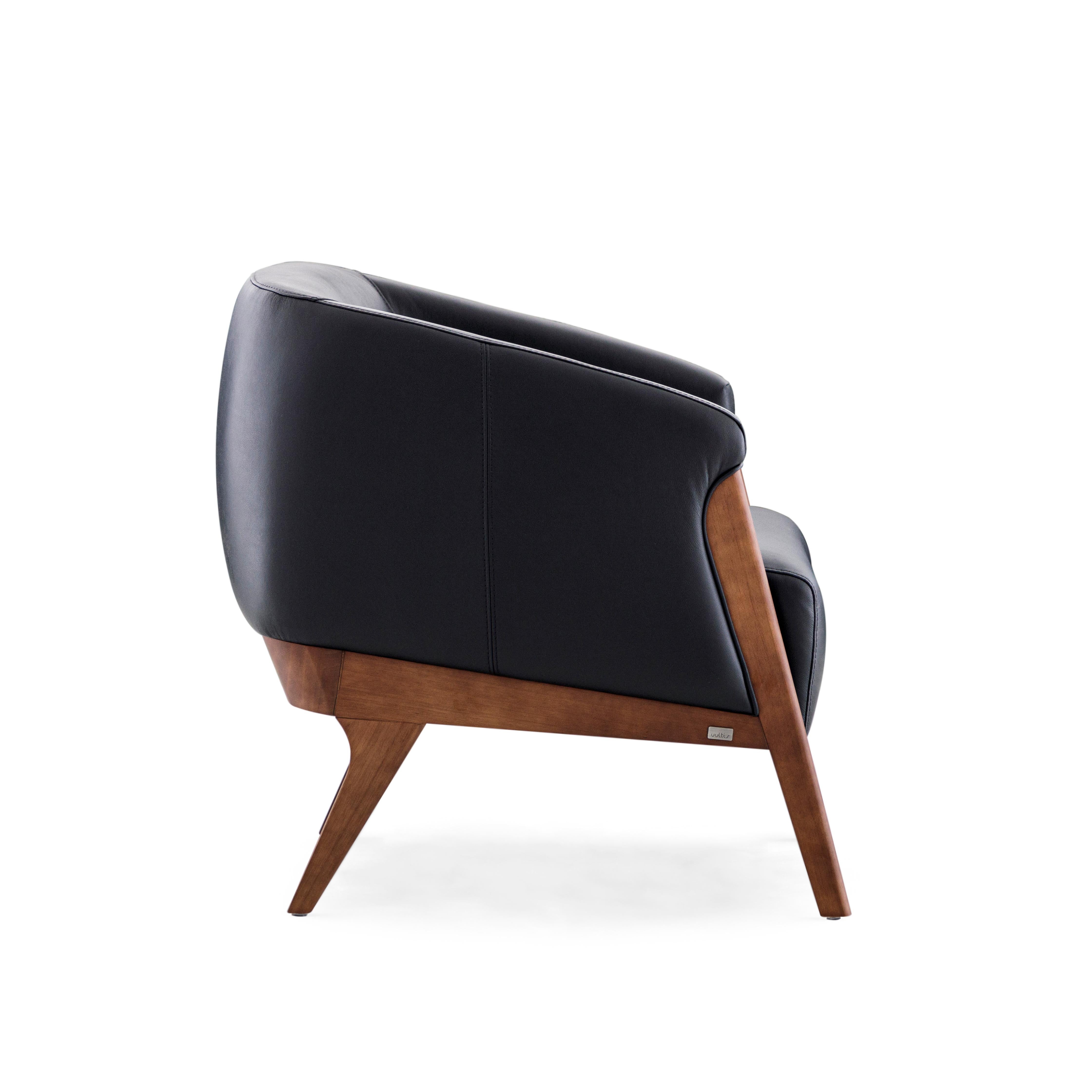 The Abra armchair is a welcoming addition to any room in your decor, with beautiful black upholstery and a walnut wood finish frame. This armchair has been created by our amazing team of architectors and designers from Uultis in order to bring