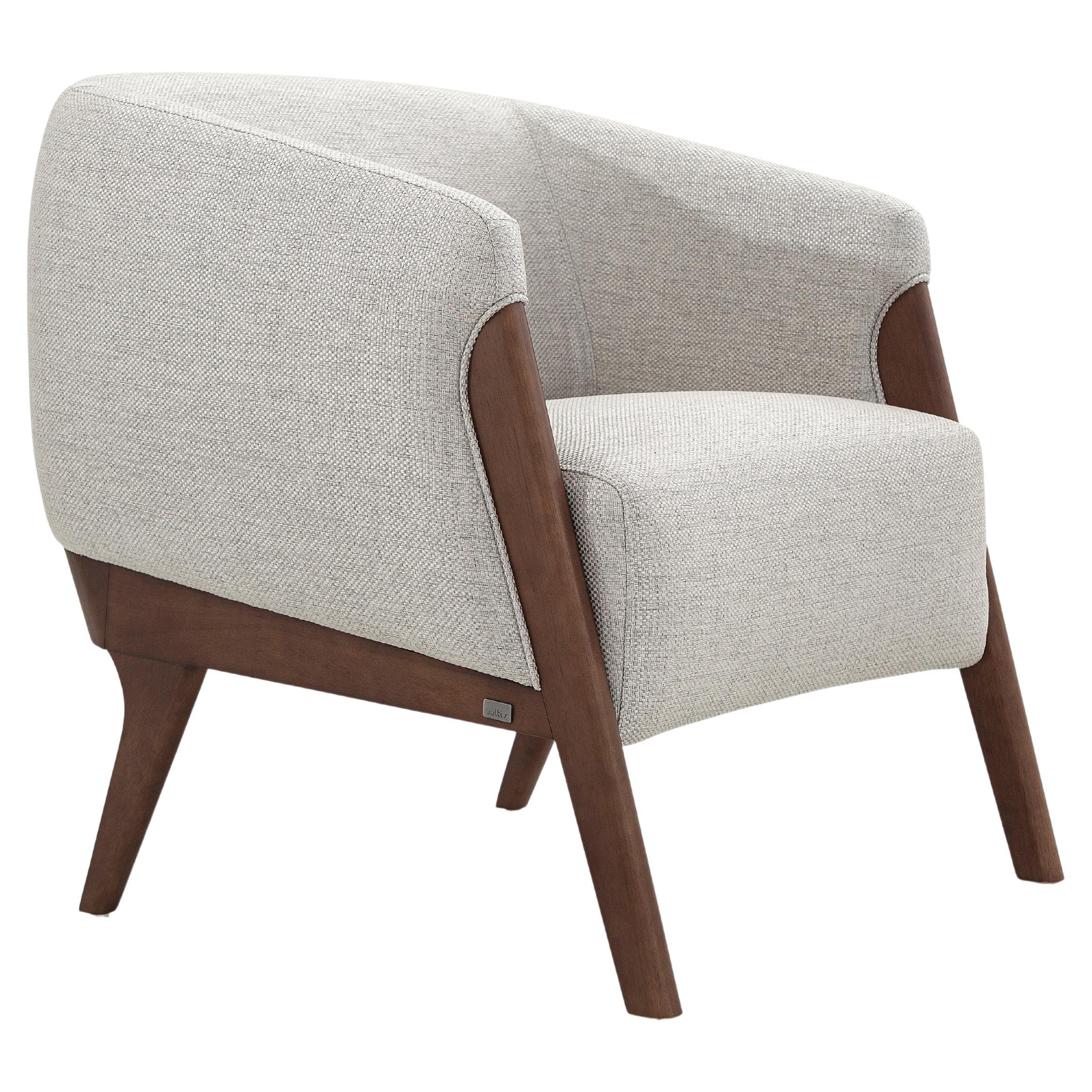 The Abra armchair is a welcoming addition to any room in your decor, with a light gray fabric upholstery and a walnut wood finish frame. This armchair has been created by our amazing team of architectors and designers from Uultis in order to bring