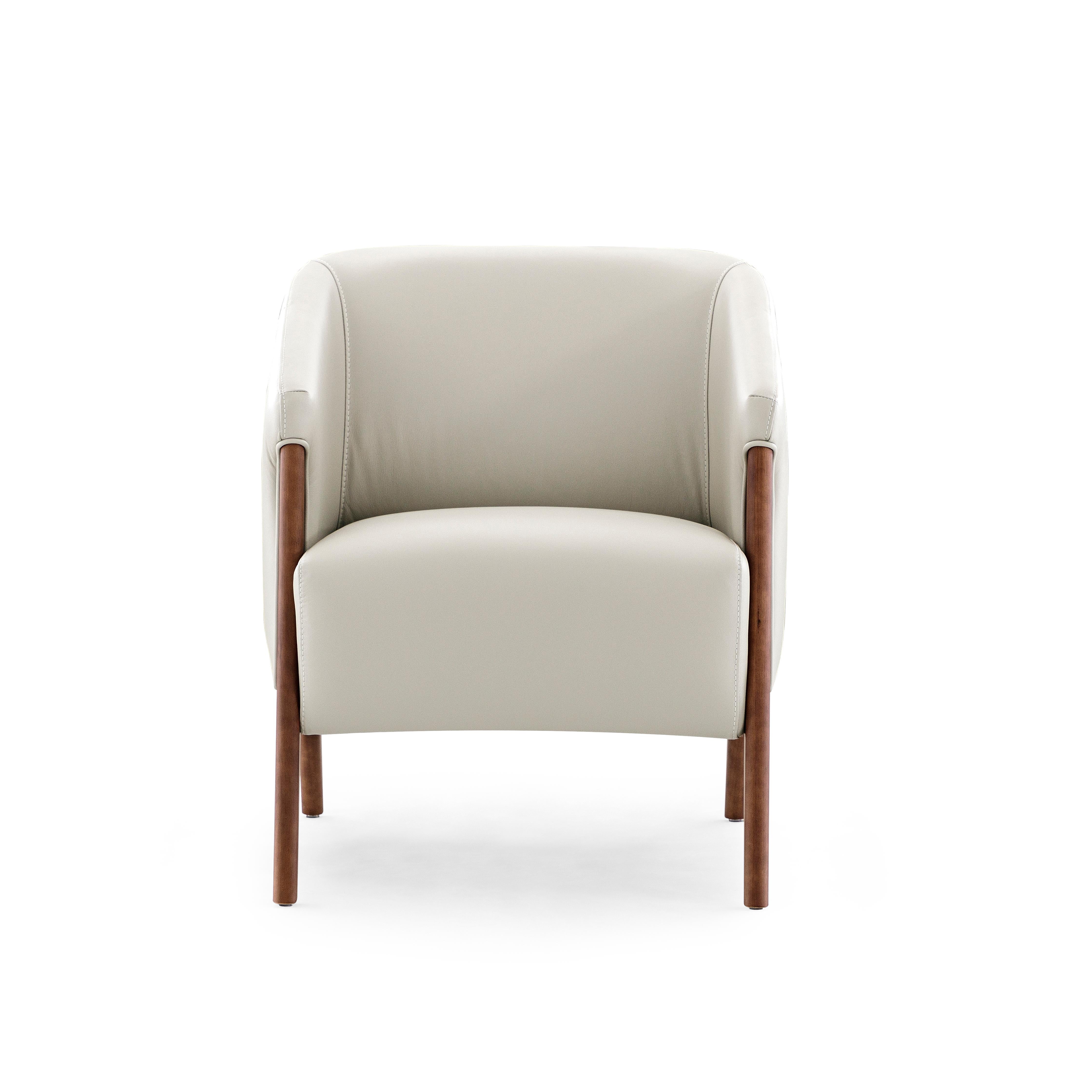 The Abra armchair is a welcoming addition to any room in your decor, with beautiful white leather upholstery and a walnut wood finish frame. This armchair has been created by our amazing team of architectors and designers from Uultis in order to