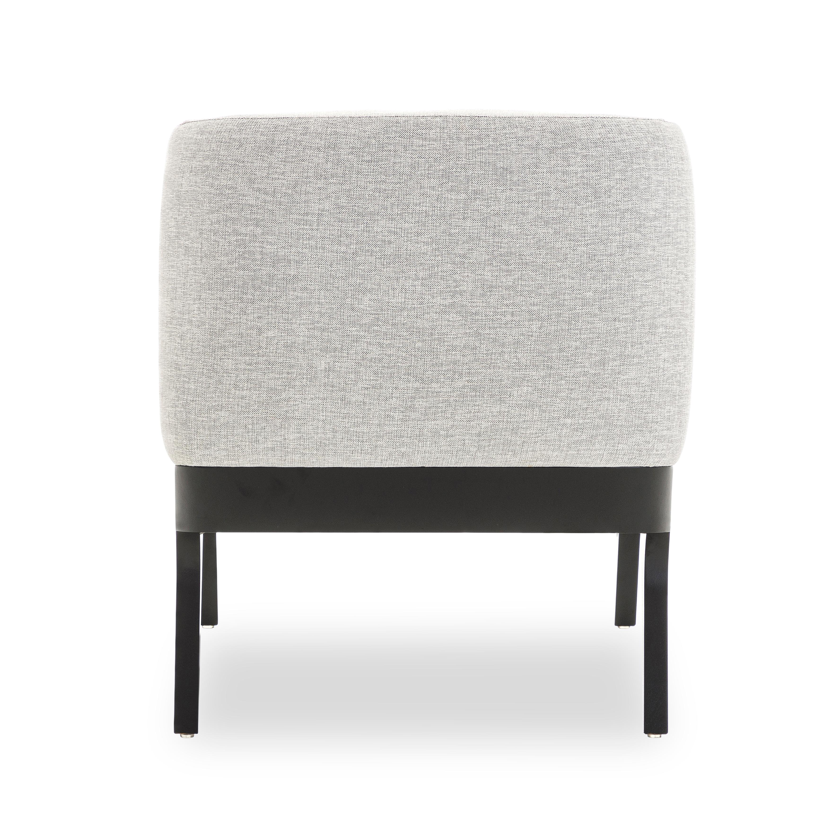 The Abra armchair is a welcoming addition to any room in your decor, with black and white fabric upholstery and a black wood frame. This armchair has been created by our amazing team of architectors and designers from Uultis in order to bring