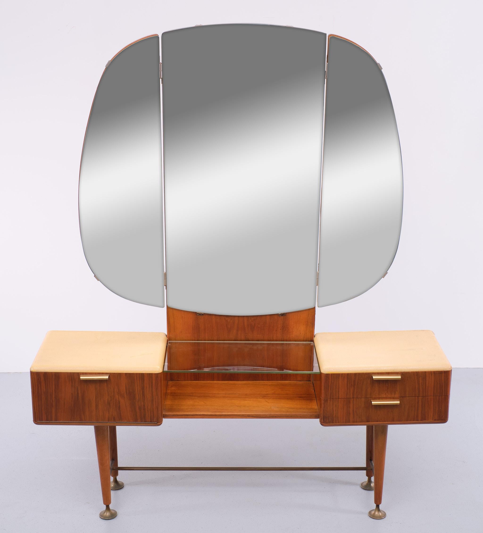 Very nice elegant Vanity or dressing table. Folding mirrors. High solid Brass 
adjustable feet, and curved cabinets and anti dust drawers. Typical for 
Architect Abraham A Patijn well now for its curved furniture. manufactured 
by Zijlstra Joure