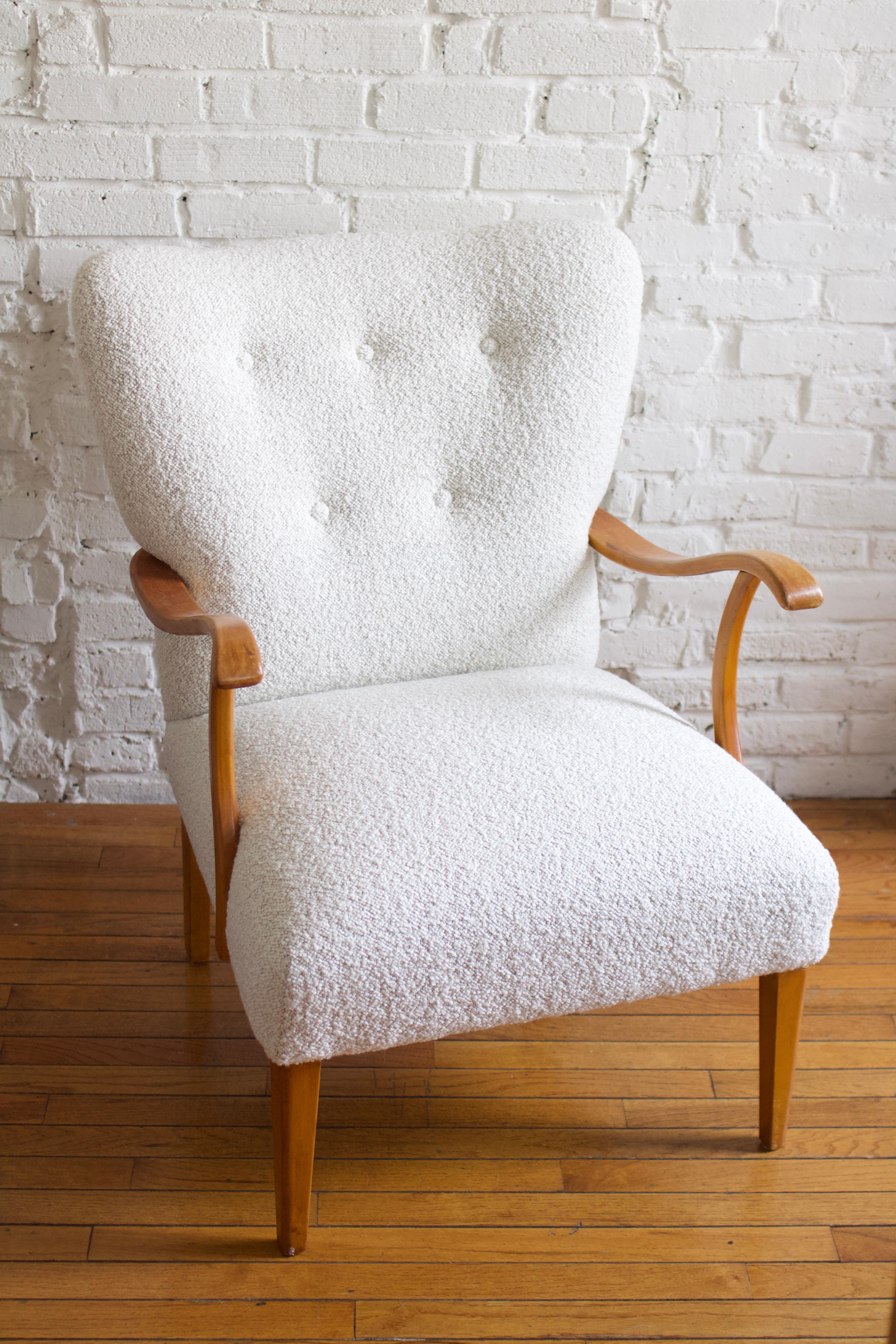Fabulous 1950's dutch armchair attributed to Abraham A. Patijn, made in the Netherlands. This chair is in solid condition and was recently reupholstered in a nubby woven white fabric. The chair has an impressive beechwood frame with sculptural arms,