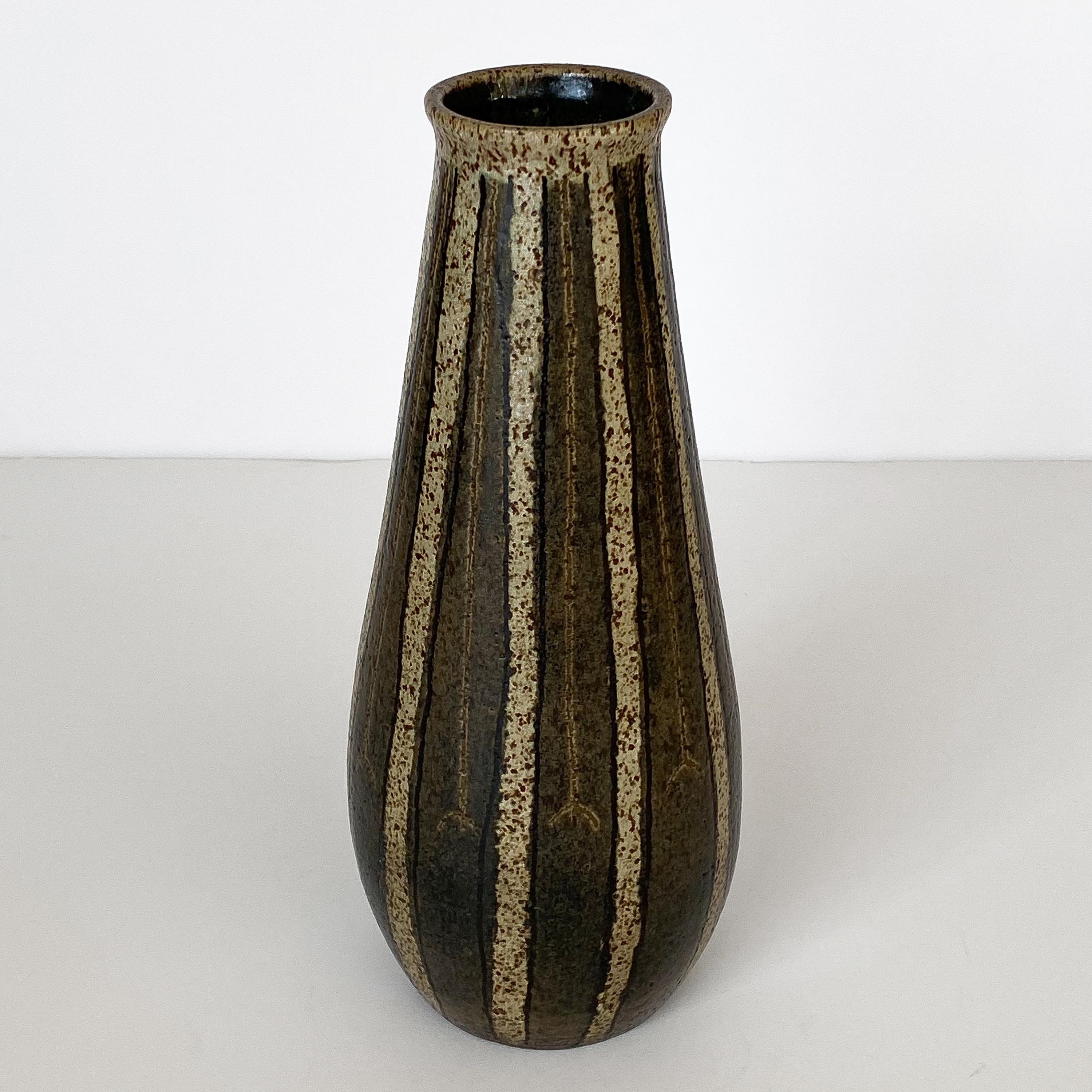 Abraham Cohn Studio Pottery vase glazed in earth tones of browns, tan and black with striped pattern, circa early 1950s. Abe Cohn was a Wisconsin based potter. Measures: Overall 12.75