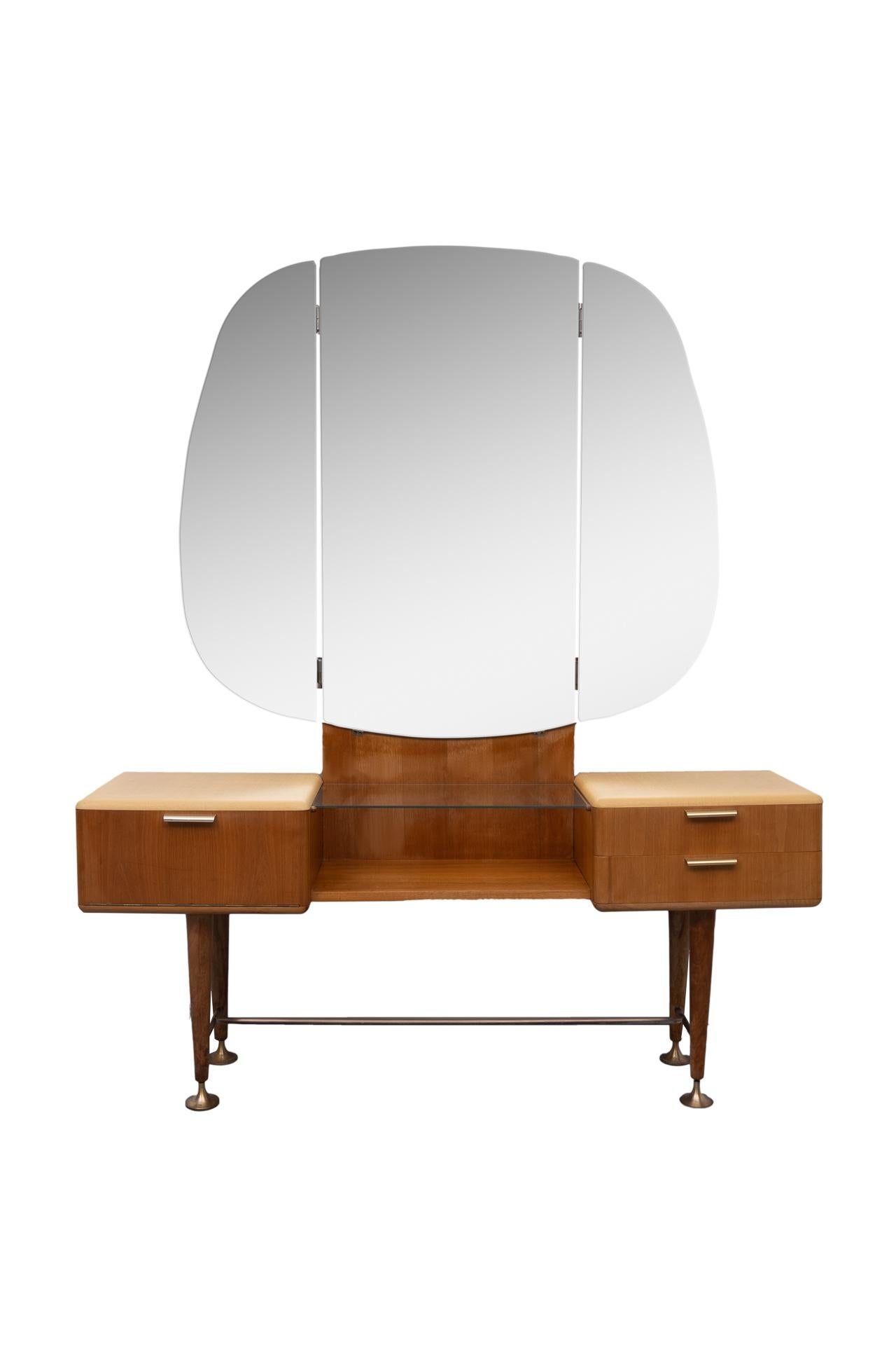 Wonderful and rare dressing table. Design by A. Patijn for Zijlstra Joure Holland 1950s well now for his curved furniture. Solid brass elegant adjustable feet. Original mirrors. The drawers feature a bent plywood interior. Brass handles.
  