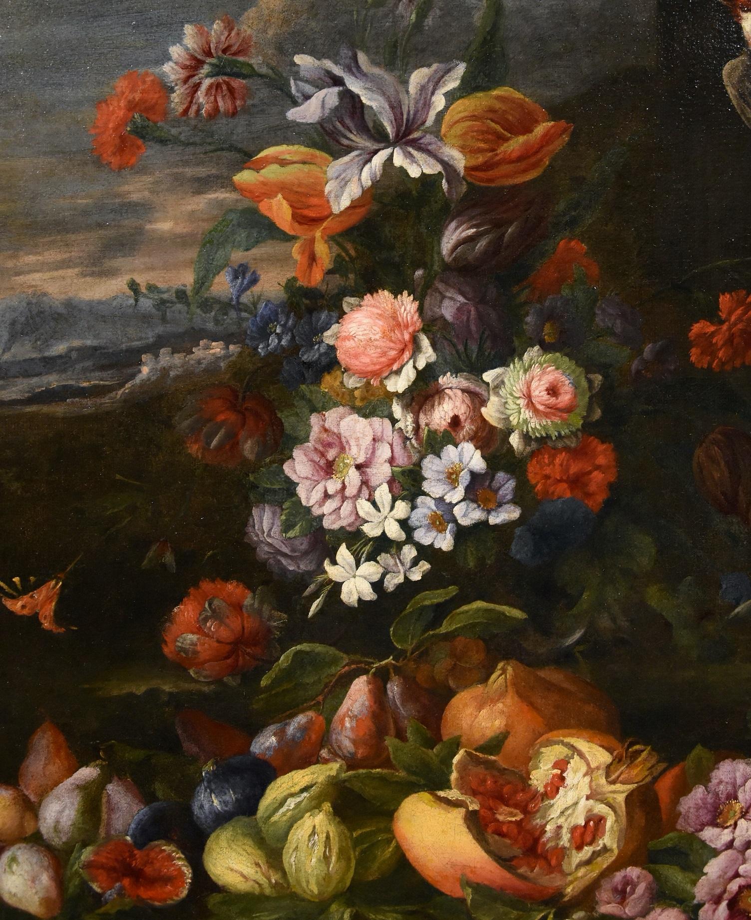 Painter active in Rome second half of the seventeenth century - Entourage of Abraham Brueghel (Antwerp, 1631 - Naples, 1697)
Still life of flowers and fruits with a landscape in the background and a small goldfinch in flight

Oil painting on