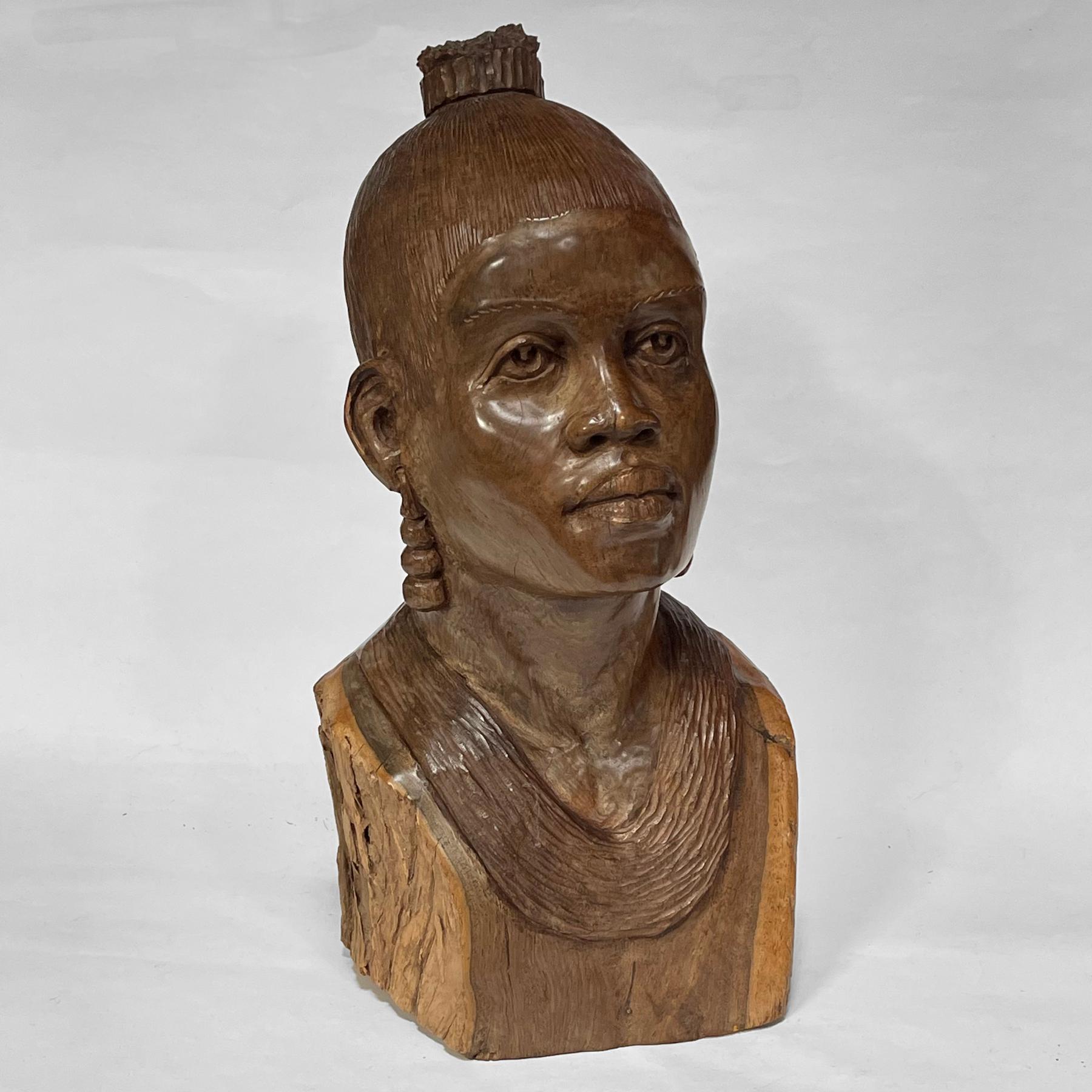 This exquisite bust by African artist Abraham Chikumbirike is carved from dense ironwood. The finely detailed likeness of a dignified woman is especially impressive due to the difficulty of the material. 

Hand signed on the bottom.

 17.5
