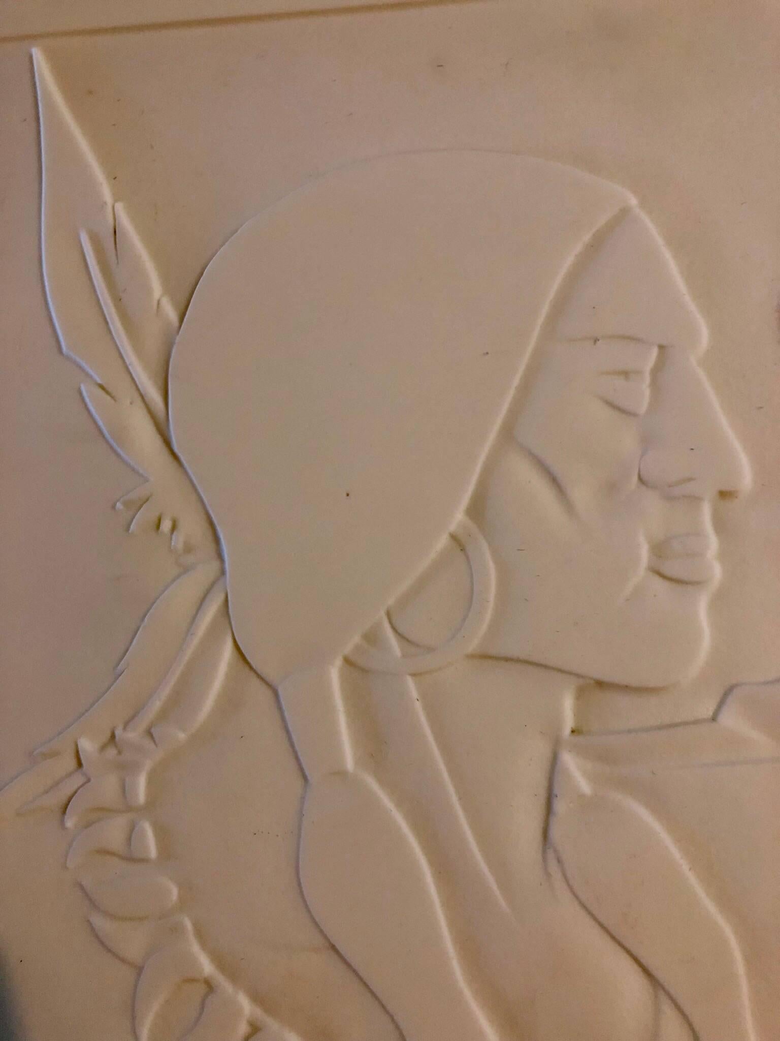 This is a carved glass panel. I belive this is milk glass. it is a classic Americana scene of a cowboy or frontier trapper and an Indian or Native American with a feathered headdress. 

Abraham Harriton was a Romanian-born Jewish modernist artist