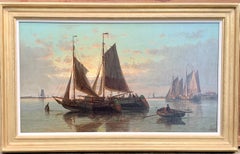 19th Century English or Dutch fishing boats at calm, with a landscape and sunset