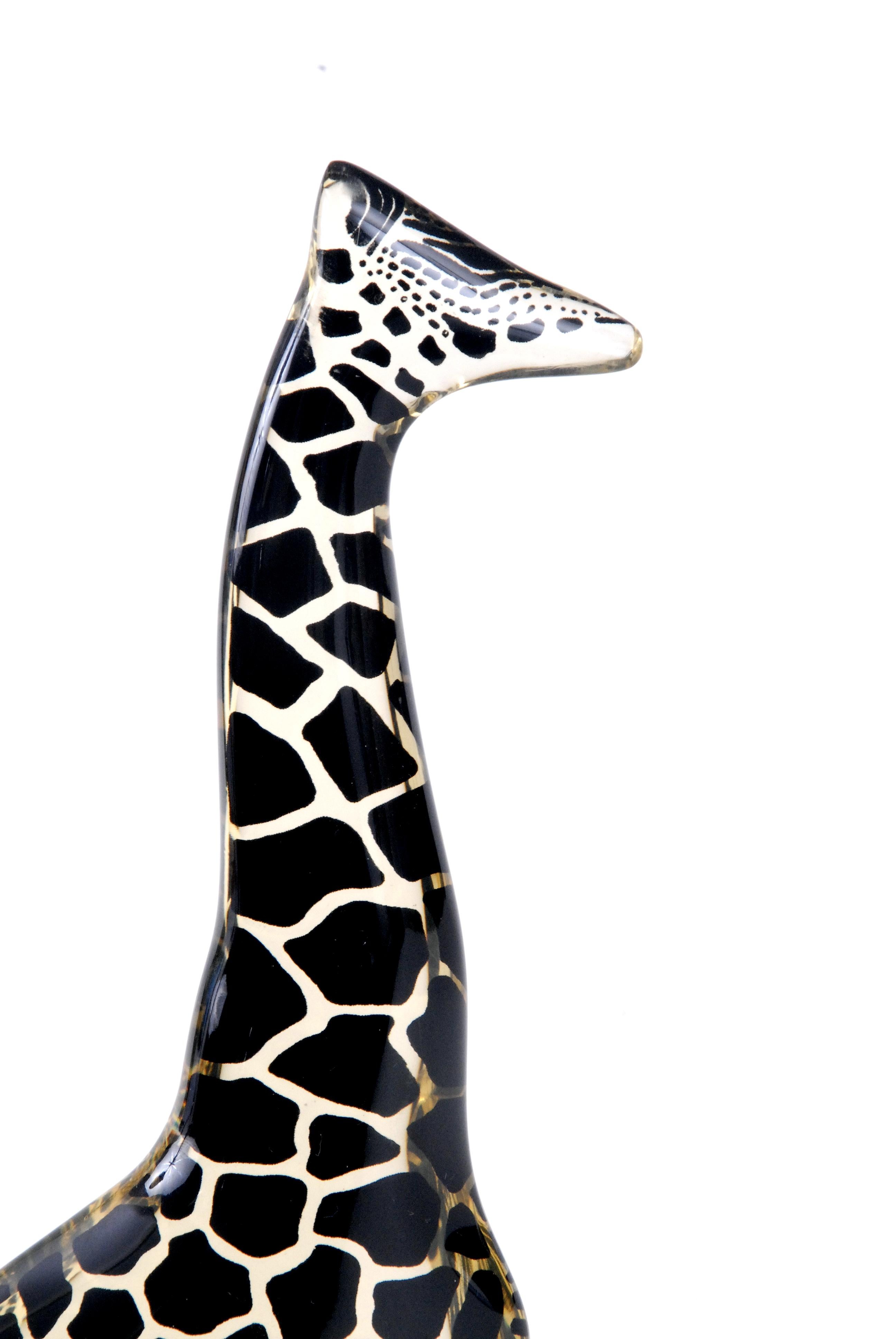 A medium sized black giraffe in perfect condition with its label still attached, last photo shows comparison between the 2 giraffes listed for sale.
This one is 21.5 cm in height.