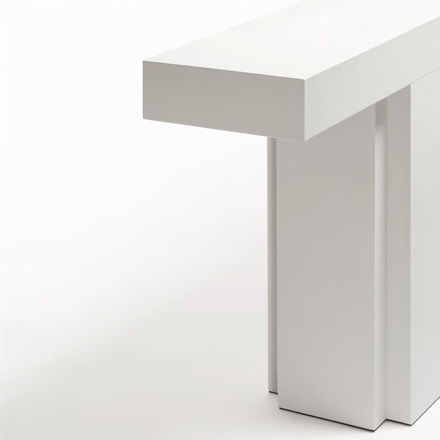 Console Table Absolut Leather with solid wood structure, 
all covered top in genuine leather in white color finish.
Also available in other suede colors on request.