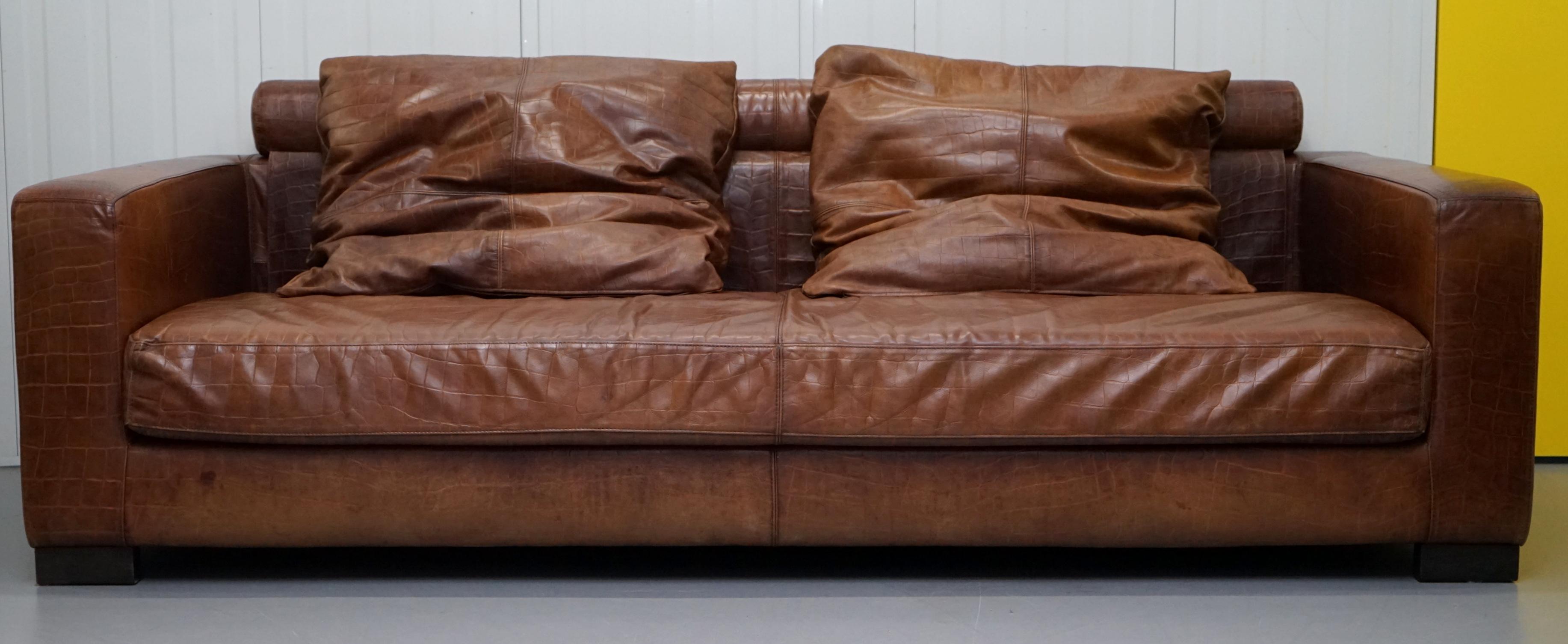 We are delighted to offer for sale this very rare RRP £15,500 brown leather with Crocodile patina Fendi Casa sofa bought from Chicago Home Design

This sofa is amazing, it is very large and deep, it has one long bench cushion as opposed to three