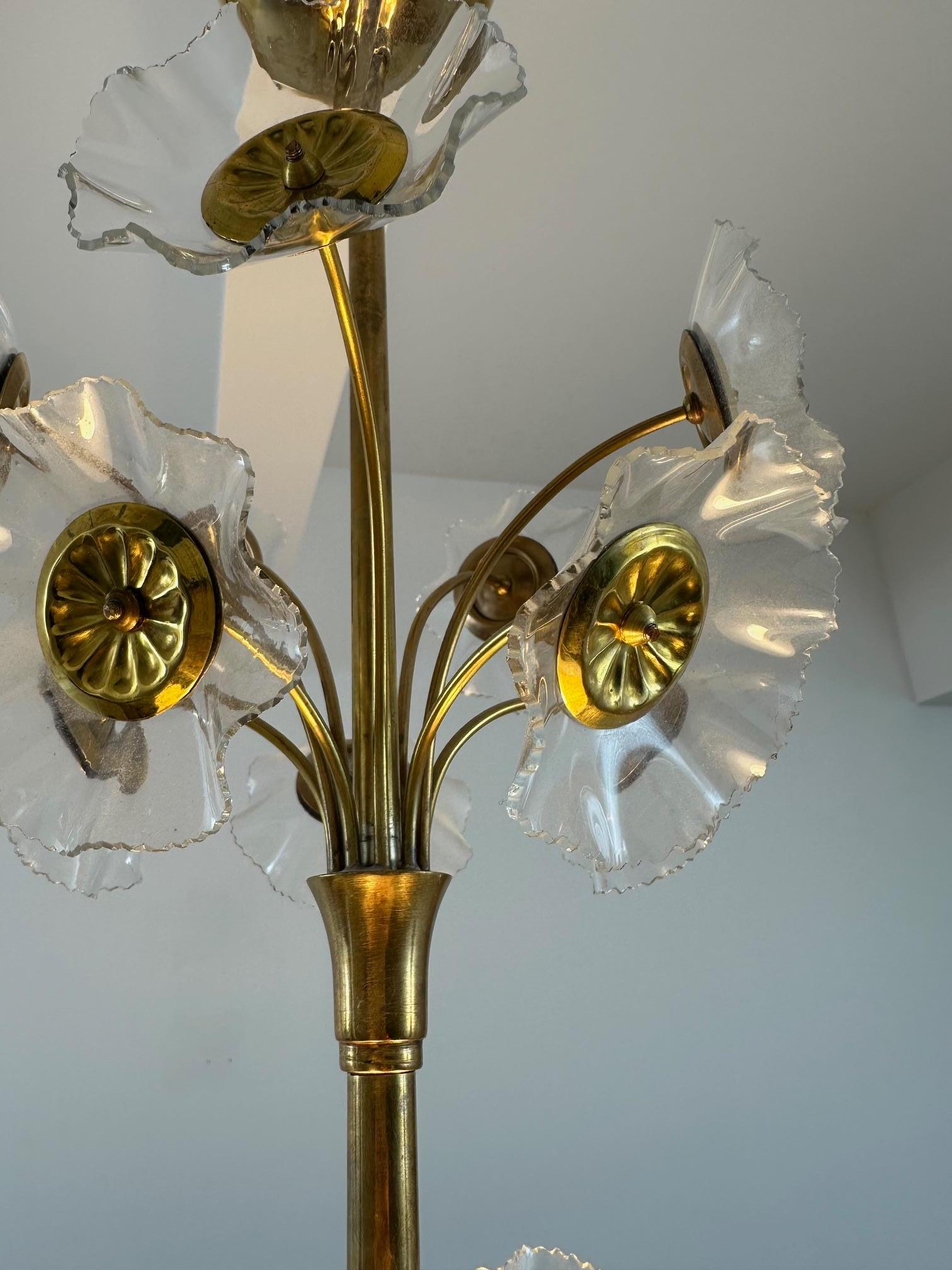 The most beautiful version of Lisa Johansson-Pape's floral chandelier.  The detailed floral decorations in this particular unit are on their own league compare to other similar Johansson-Pape chandeliers.  

This is very rare chandelier designed in
