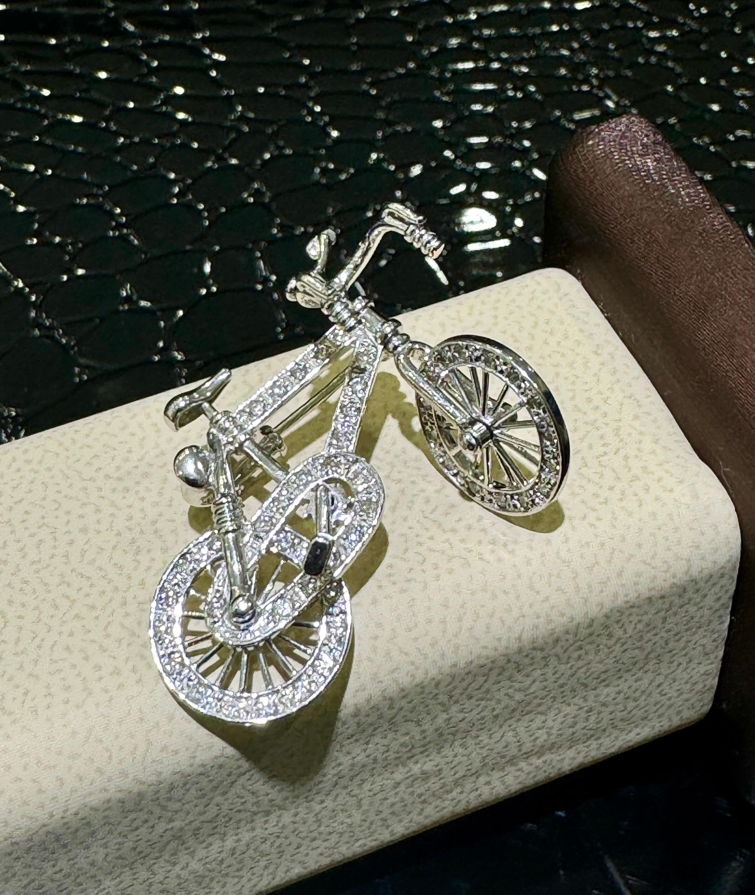 Absolutely Incredible And Unique Diamond Bicycle Broach/Pin In 18k White Gold .

Both wheels, steering wheel and pedals are moving!

Approximately 0.50 carats in diamonds.

Length of the bike is approximately 1 3/8”,

Height is approximately 1”