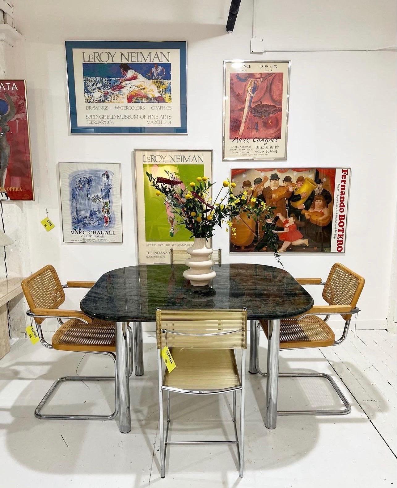 Absolutely stunning custom marble & chrome dining table.

A rare one-of-a-kind piece that would be perfect for NYC apartments. Such gorgeous hues throughout the marble. The chrome legs present no signs of rust. Table is in perfect condition.