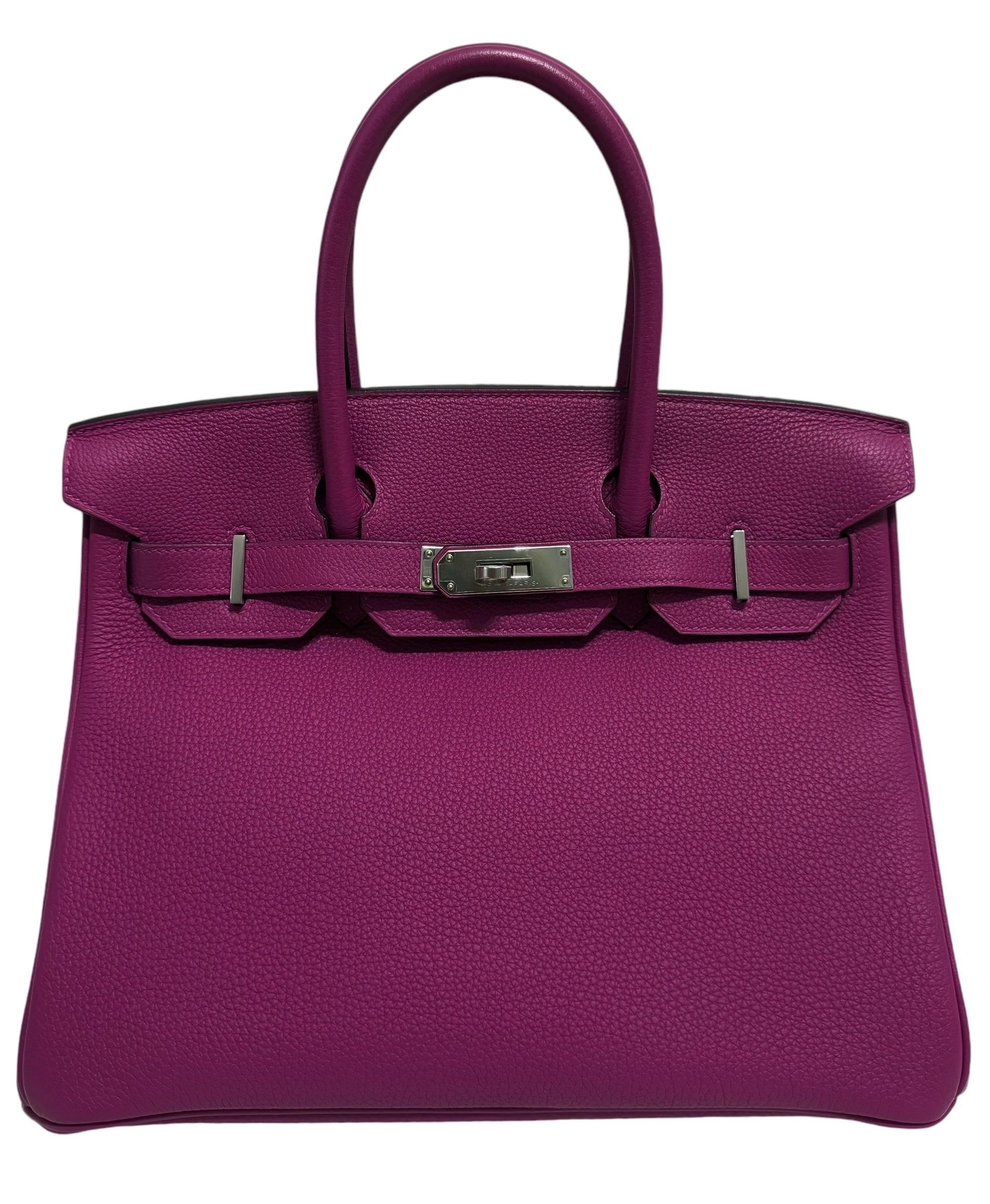 Absolutely Stunning  Hermes Birkin 30 Rose Pourpre Togo Leather complimented by palladium Hardware.  2017 A Stamp. Pristine Condition, Plastic on All Hardware.

Please keep in mind that this is a pre owned item, the bag has been carried before,