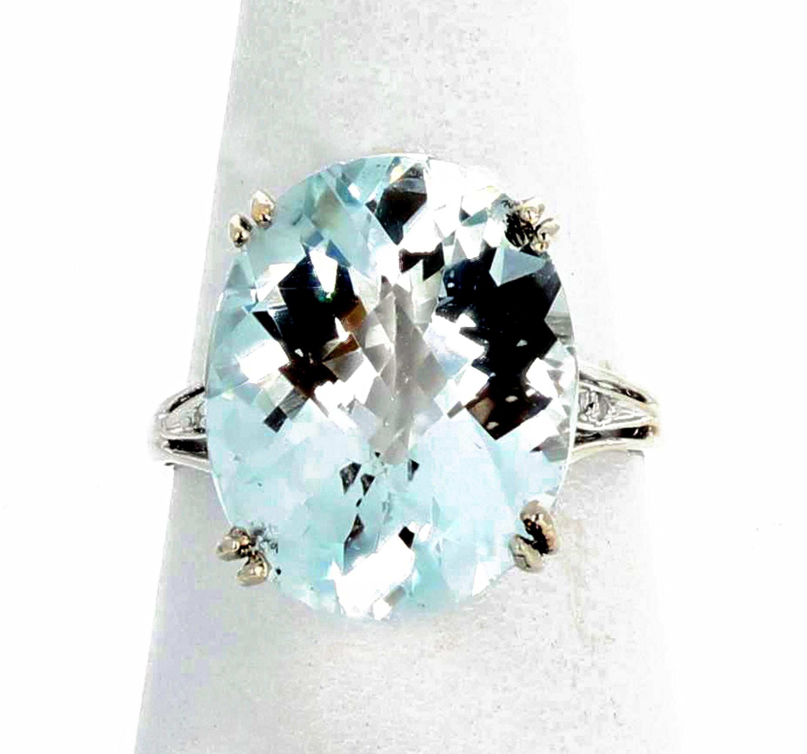 This is a very very light blue glittering magnificent 15.4 carat  very rare NATURAL Topaz.  It is checkerboard gem cut and when you twiddle it around on your hand it glitters from every direction.  This beautiful very rare Topaz measures