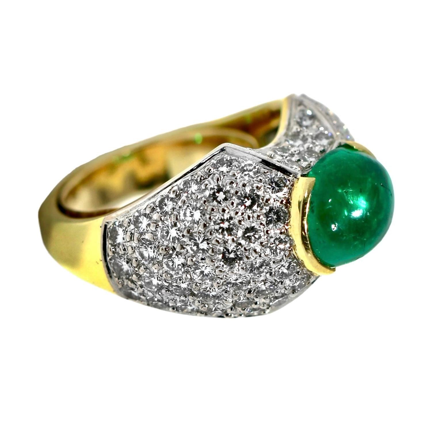 This elegant 18k yellow gold Late-20th century ladies dome ring  is set with one rich green natural Colombian emerald double cabochon weighing approximately 3.15ct. Color saturation in this gem is very intense and uniform. GIA report number