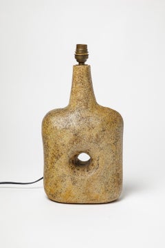 abstract 20th century yellow perforated ceramic table lamp by Christian Pradier