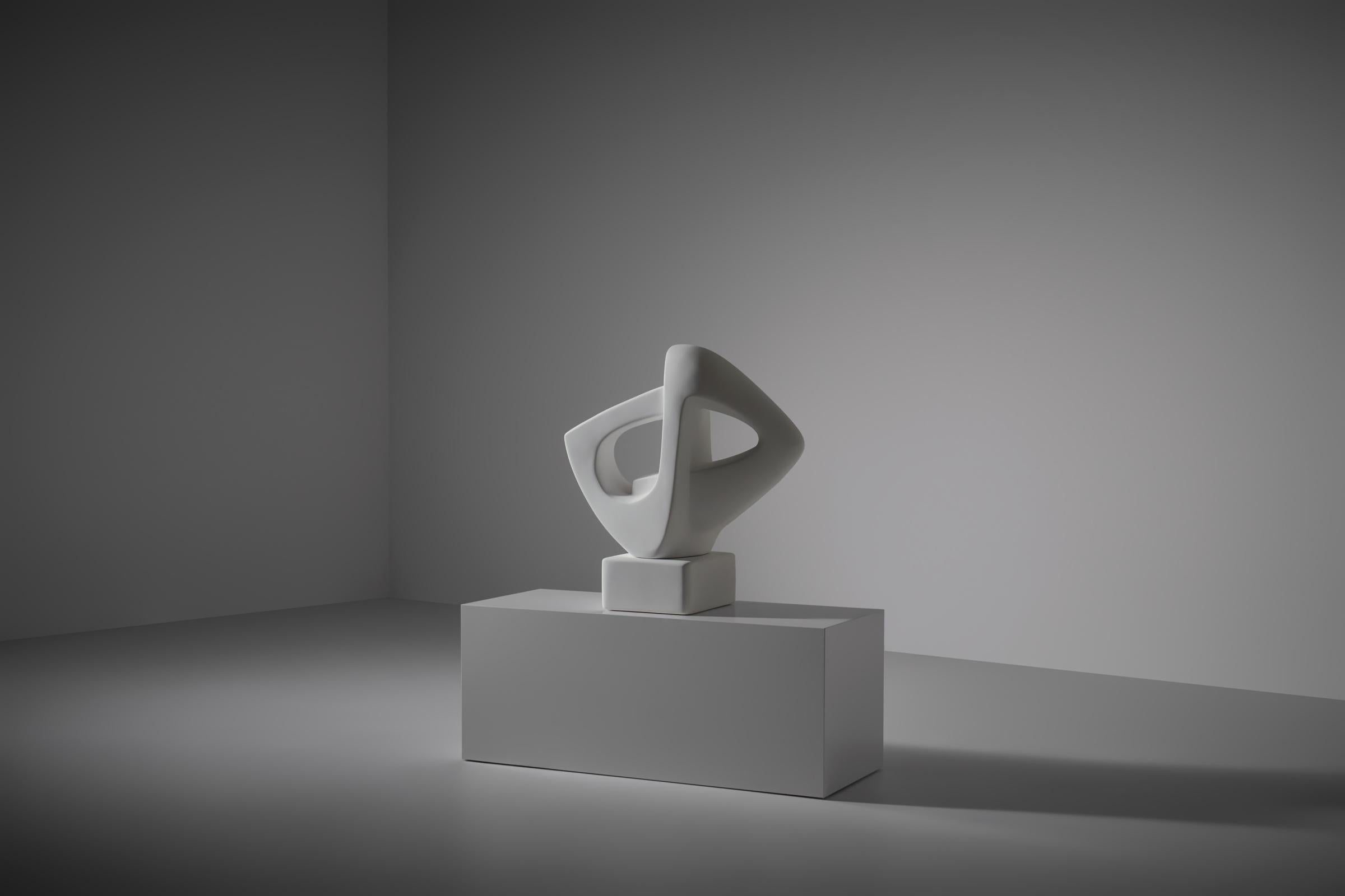 White plaster Aerodynamic sculpture, France 1960s. Refined flowing aerodynamic lines, evoking a sense of movement and lightness. The dynamic curves make a beautiful connection between open forms and space around the sculpture. Heavy solid plaster