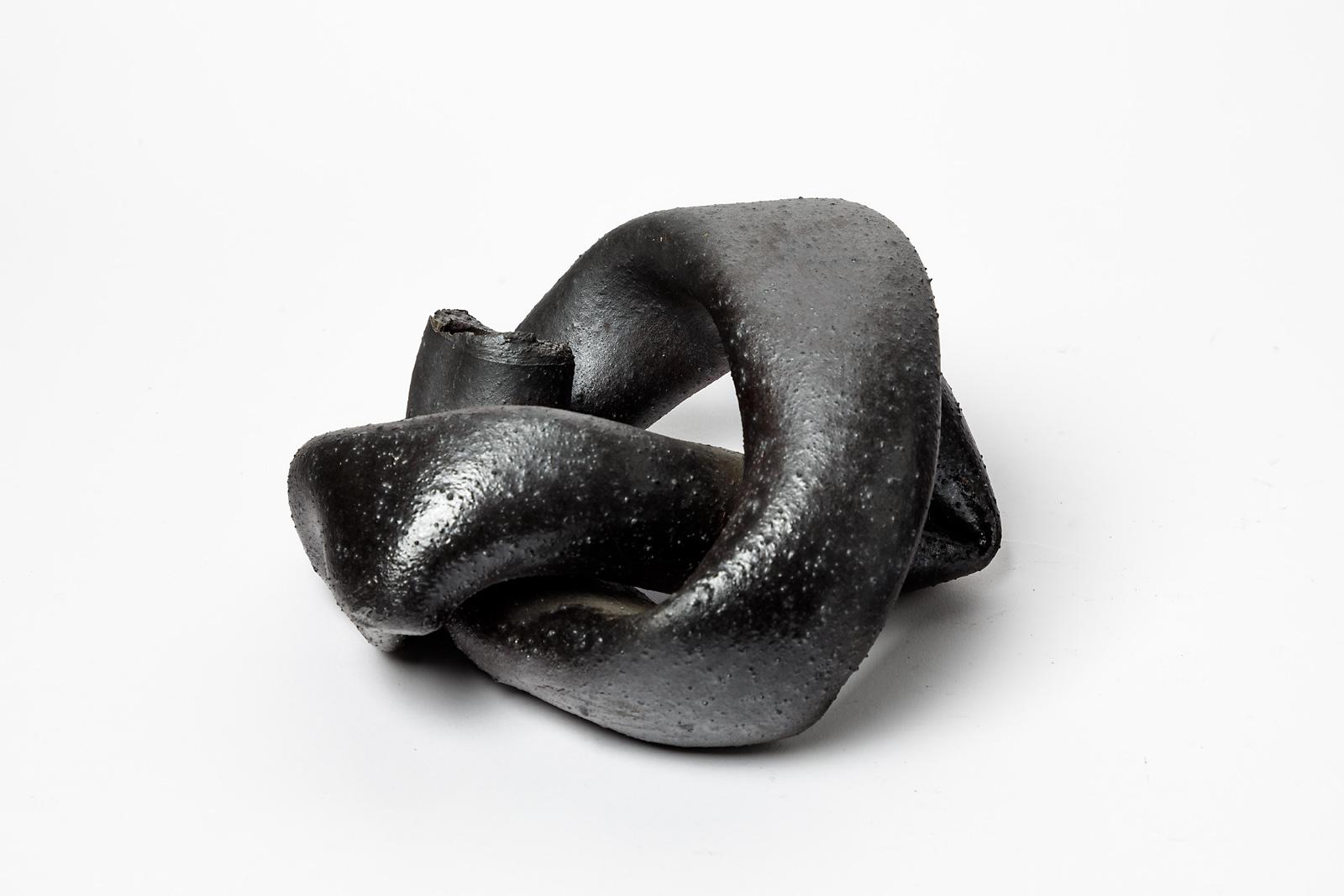 Joelle Deroubaix

Original abstract stoneware ceramic sculpture

Elegant black ceramic glazes colors

20th mid-century french design

Unique piece

Signed at the base

Height : 11 cm Large : 18 cm width : 20 cm.