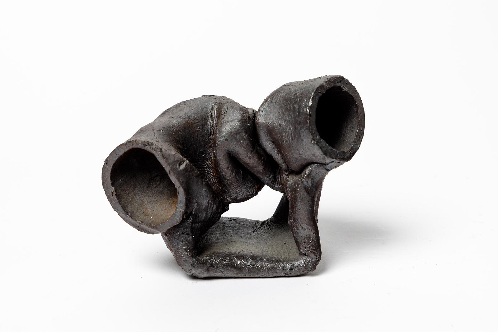 Joëlle Deroubaix

Originelle abstrakte Keramikskulptur aus Steingut

Elegante schwarze Keramik glasiert Farben

20. Jahrhundert, französisches Design

Einzigartiges Stück

Signiert an der Basis

Höhe: 10 cm Groß: 14 cm Breite: 8 cm.