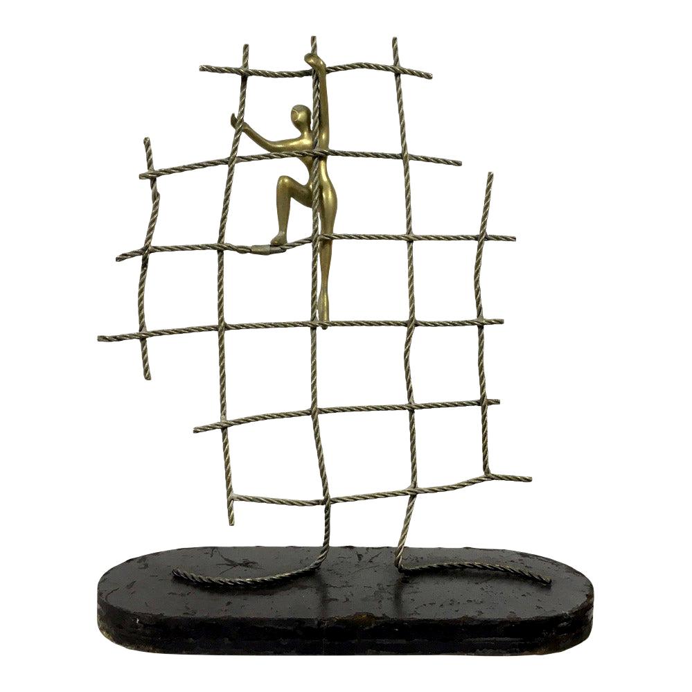 Abstract Brass Figure Climbing a Net Scuplture