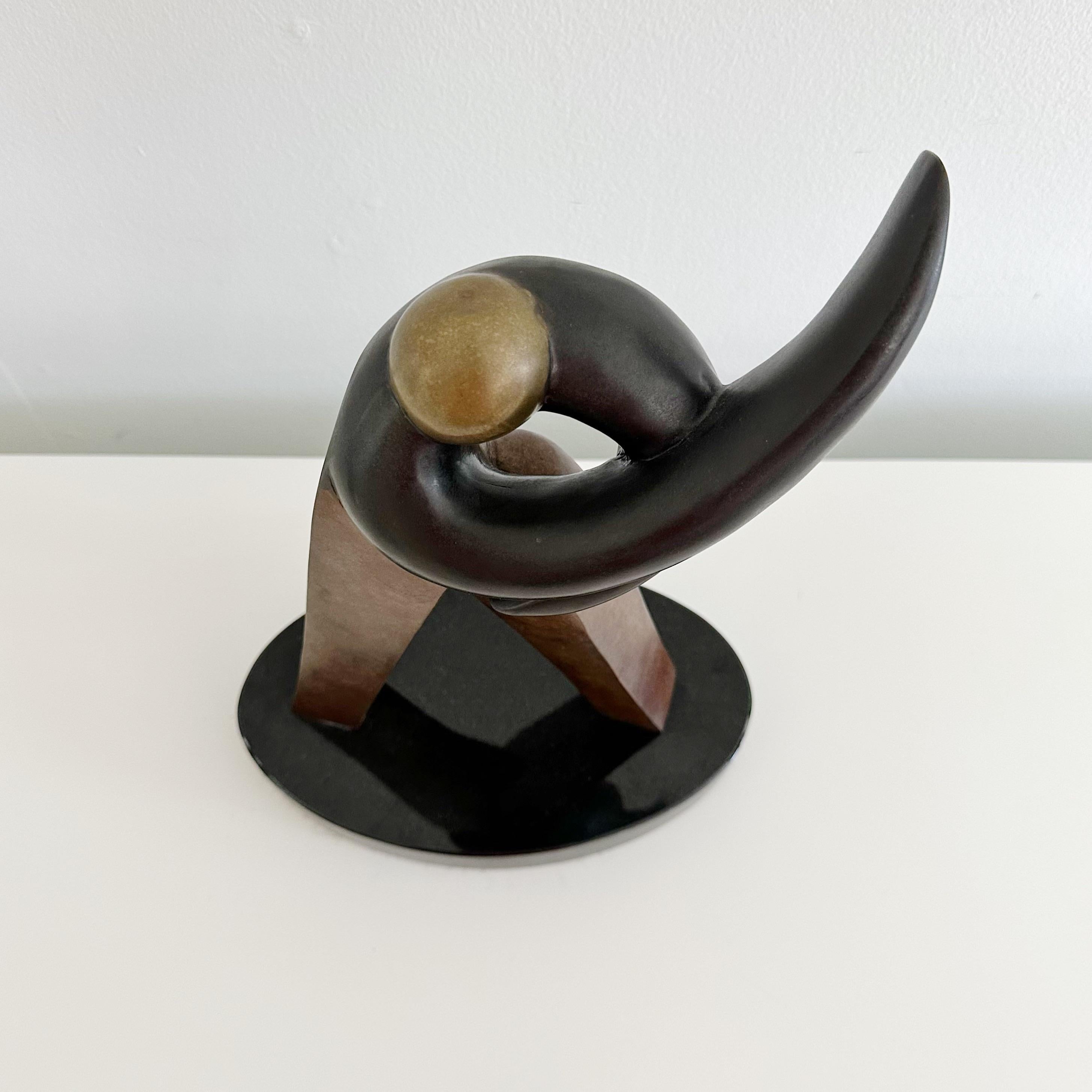 Figural sculpture by renowned San Francisco artist, Douglas Brett.
The artwork boasts a tri-color scheme using the rich hues of bronze, intensified by an enigmatic black bronze, and complemented by opulent gold.
It carries the artist's signature,
