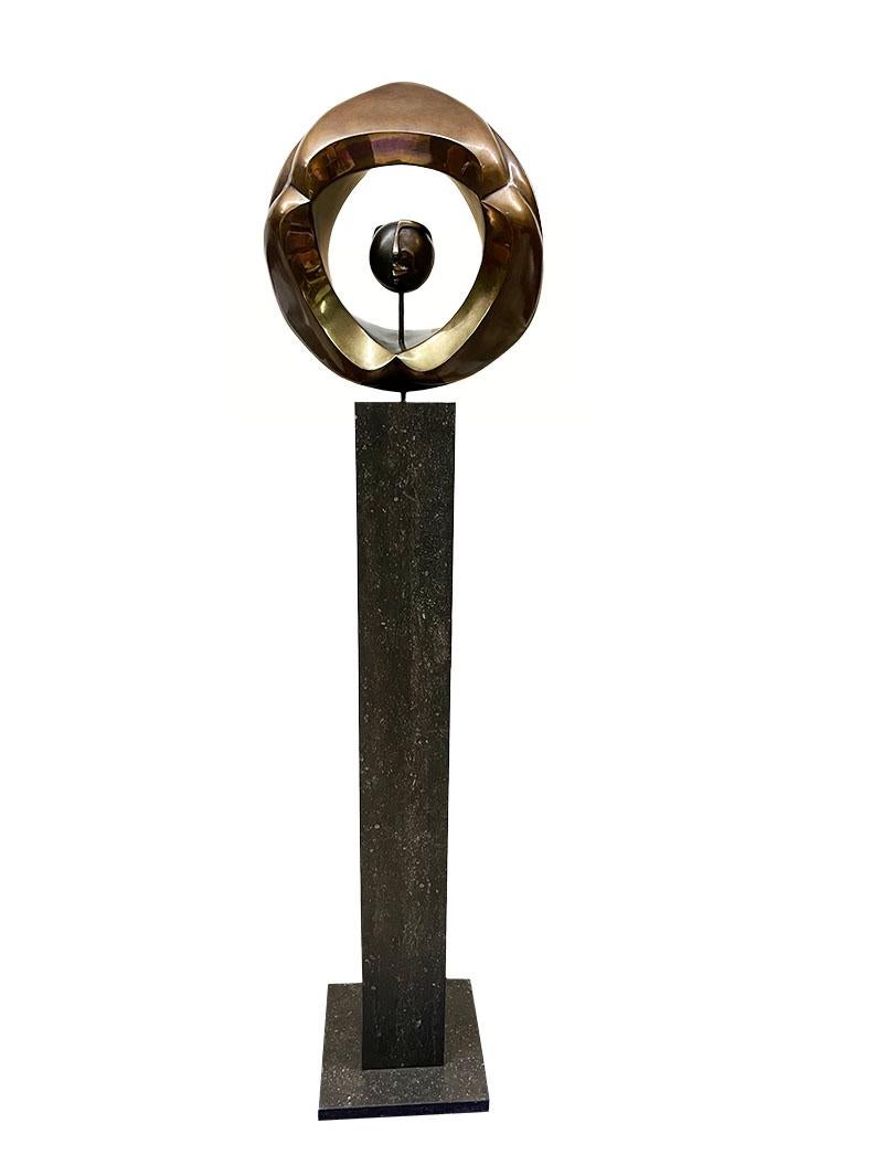 Abstract bronze sculpture by Johannes W.G.M. Ramakers (1938-) on high pedestal

Johannes W.G.M. Ramakers (1938-) a Dutch sculptor. 
The bronze titled Spectrofile III numbered edition 1/12. 
Signed under the double sided abstract round head.