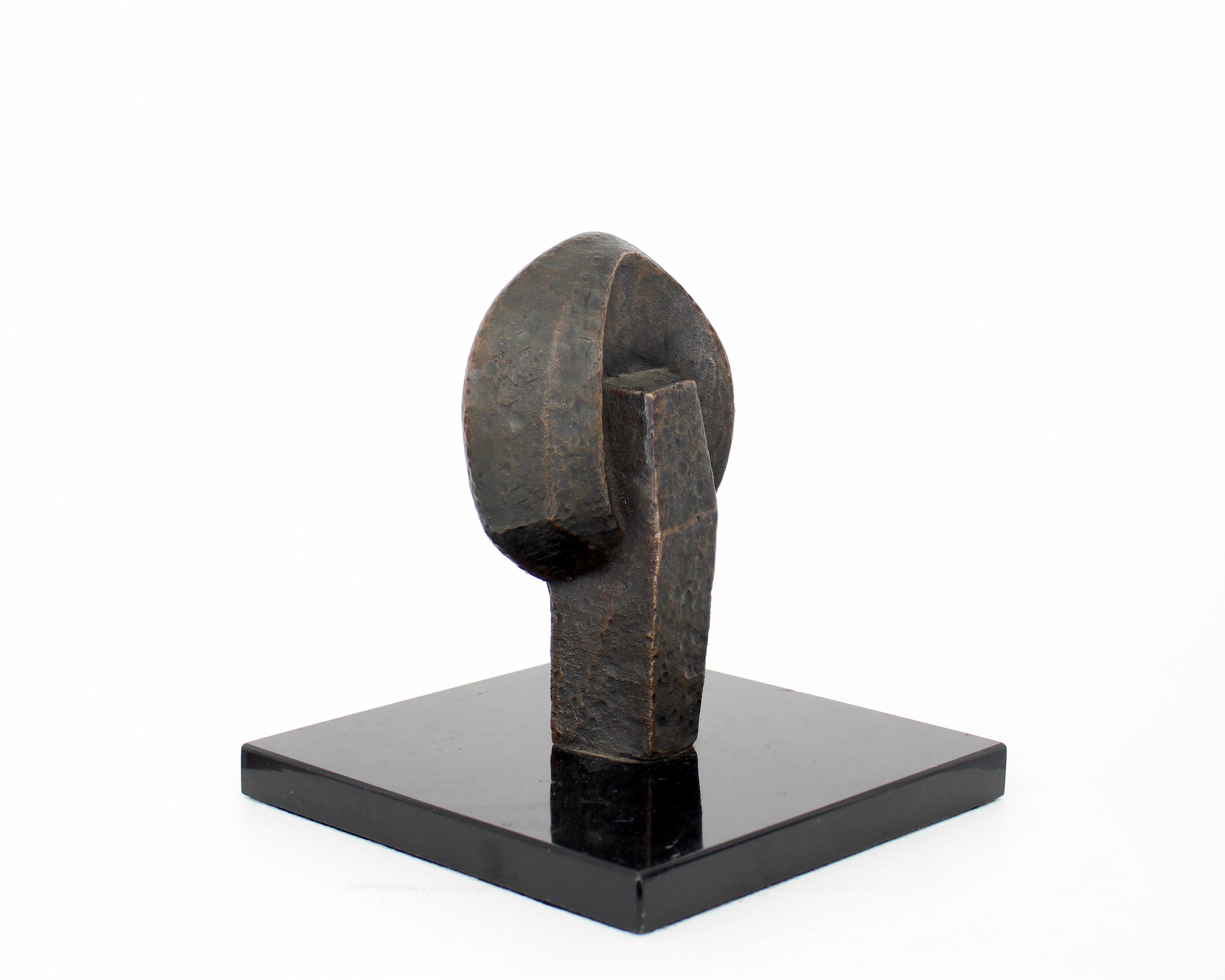 Bronze abstract sculpture sitting on a square marble plinth.
William Conrad Severson, 1924 - 1999. Born in Madison Wisconsin, he graduated from the University of Wisconsin at Madsion. 
He began his career in the late 1950's as a sculptor for
