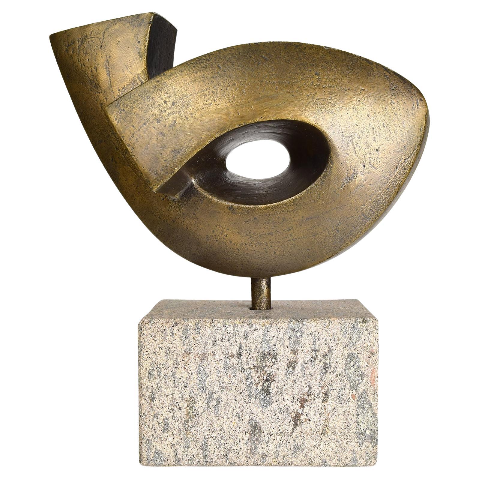 Abstract bronze sculpture on granite base with organic, geometric form