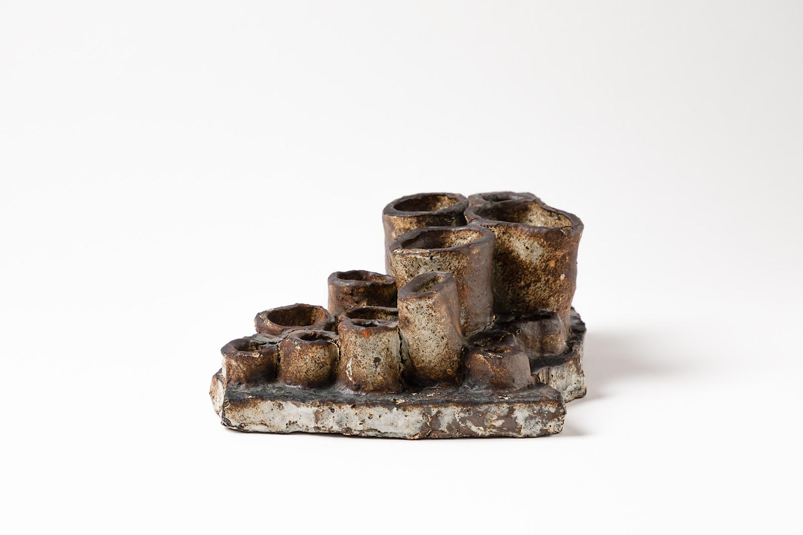 Abstract stoneware ceramic sculpture by French artist,

circa 1970, realized in La Borne.

Elegant brown, black and white ceramic colors glazes and firing effects.

Original freeform, possibility to wall sculpture.

Measures: Height 10cm,