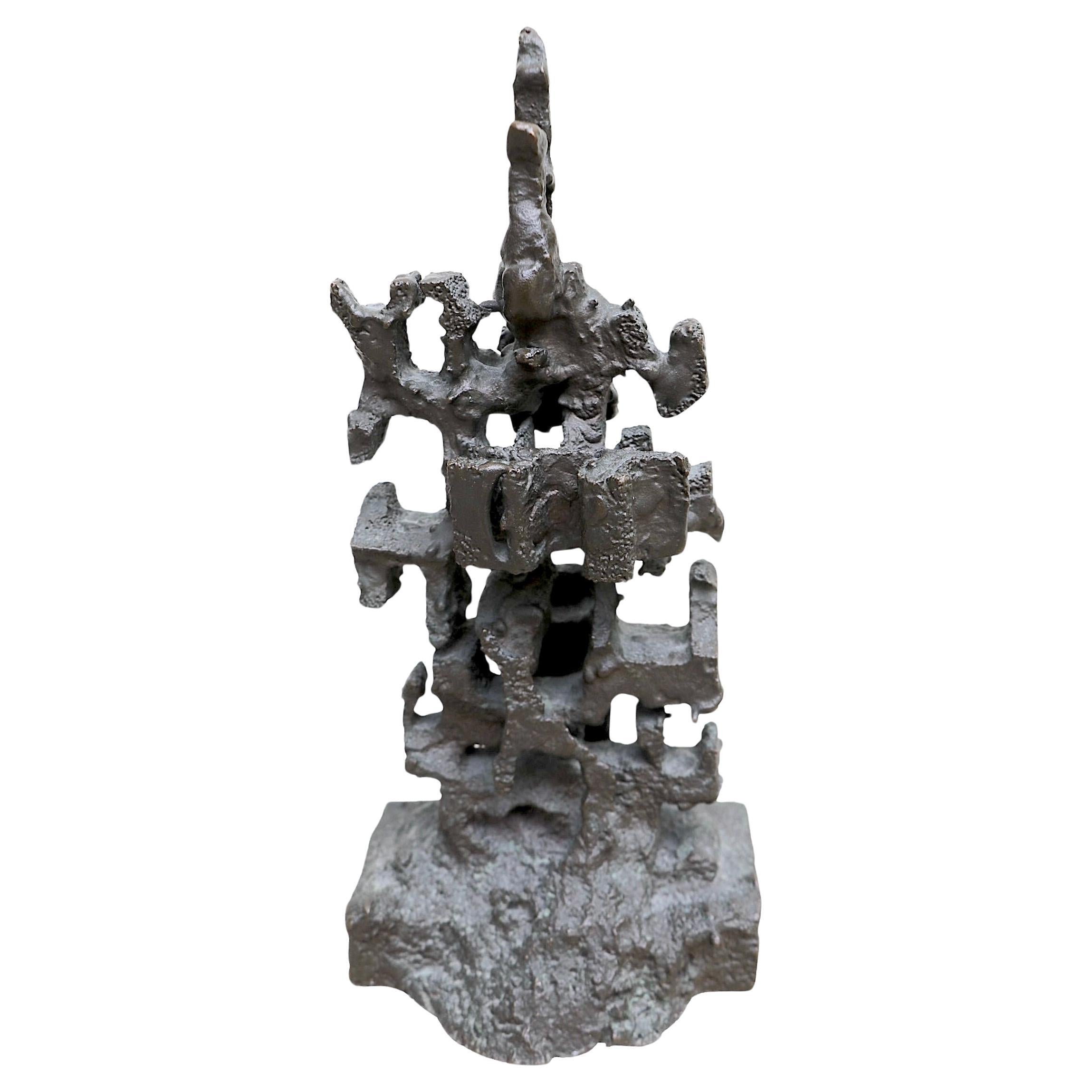 Exceptional solid cast bronze Brutalist School table top sculpture signed EJD, circa 1970's. The sculpture features a textured surface on an abstract  vertical structure. Reminiscent of the work of Paul Evans, this beautiful piece is in excellent,