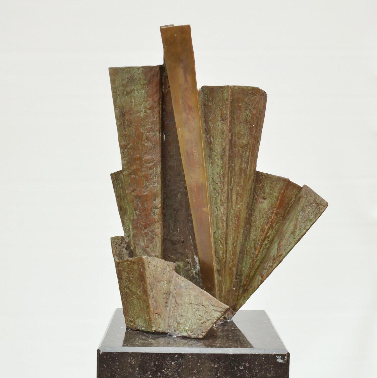 One of a two of abstract sculptures by Dutch artist Rien Goené (1929-2013) circa 1980, signed. The asymmetrical concertina shaped bronze sculpture is colored with a light green patina. Where areas are rubbed back they reveal the warm bronze