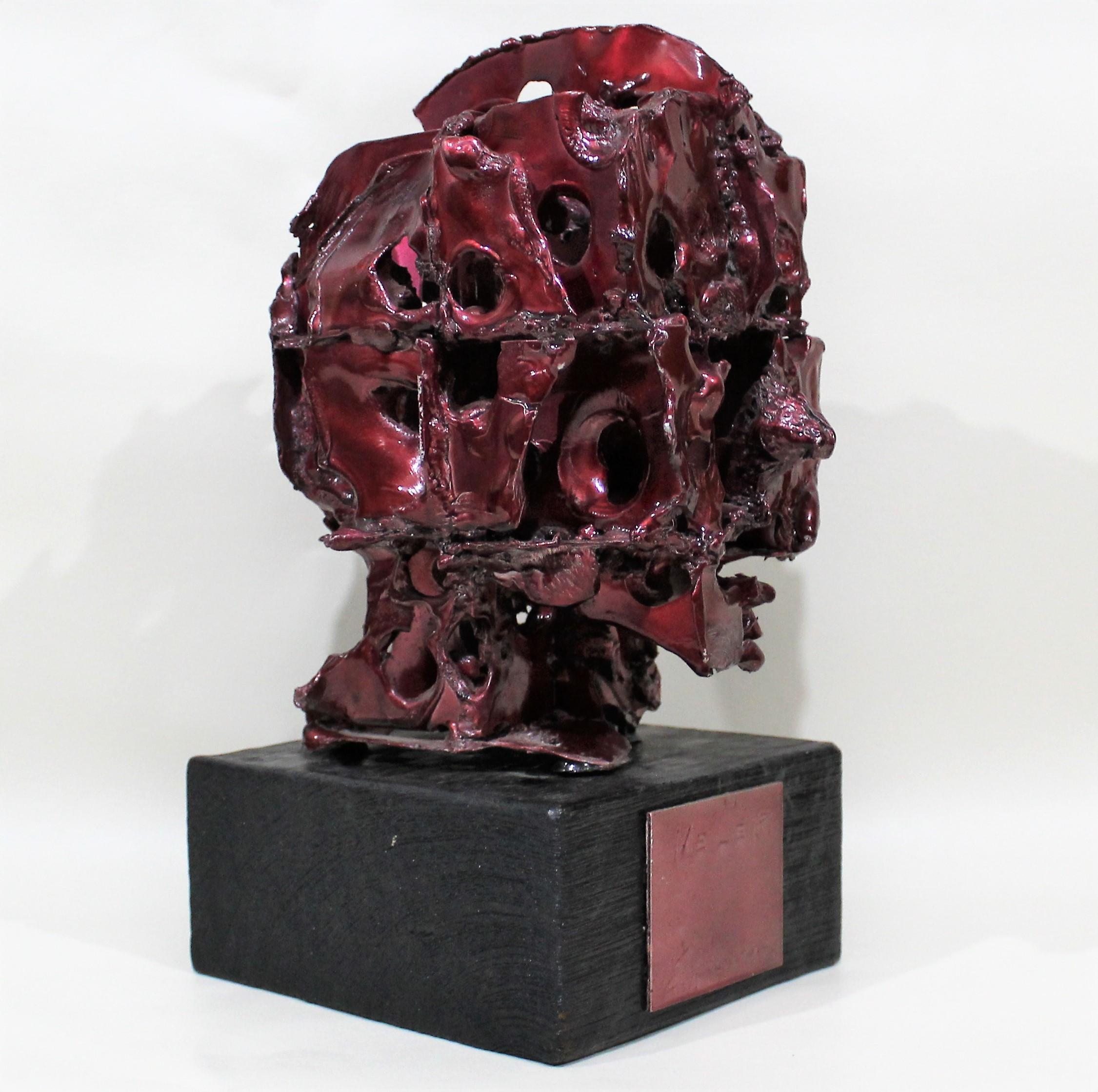 Unique brutalistic sculpture of head/face. This piece is signed but we can't make out the signature.