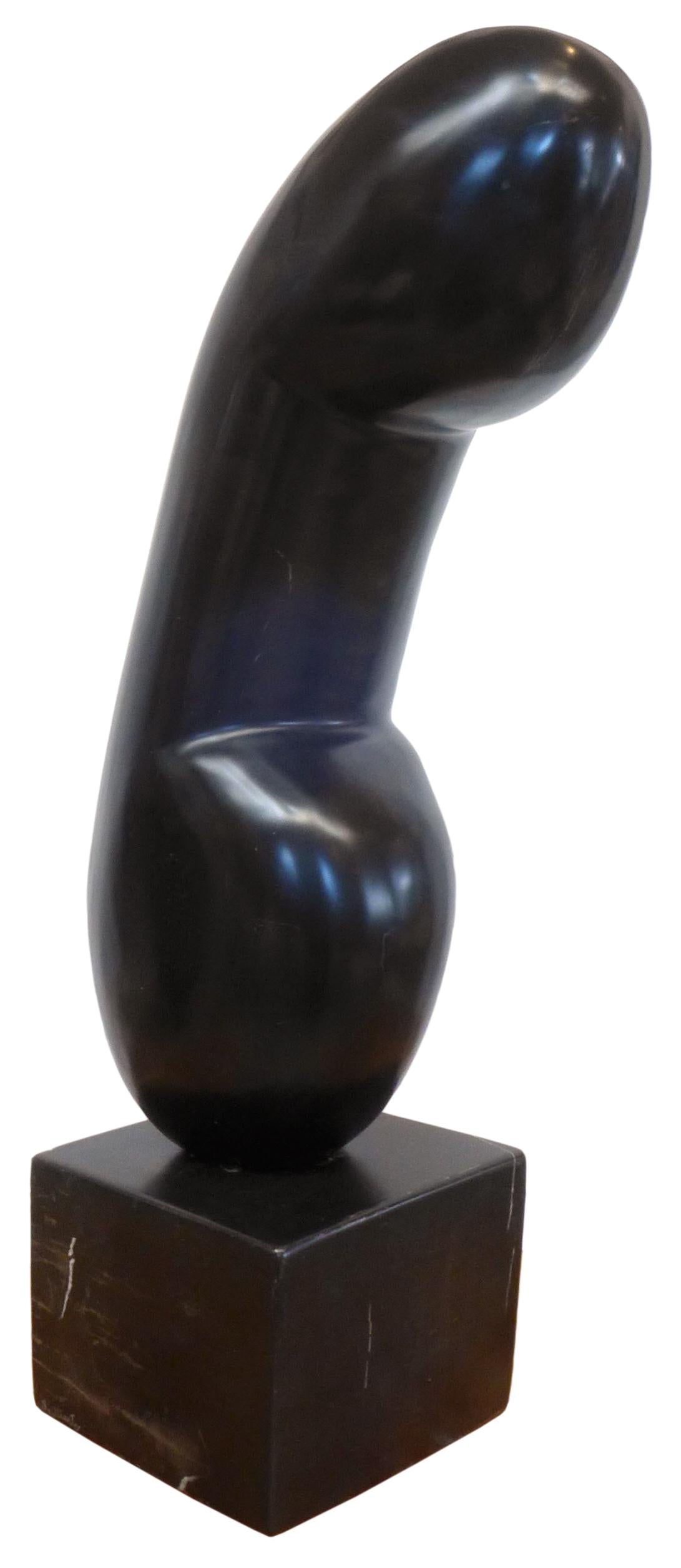 A fantastic abstract carved black marble sculpture in the manner of Constantin Brancusi. An utterance of clear phallic intent, an alluring and beautifully sculpted form of powerful scale and presence. Very subtle white veining throughout. Mounted on