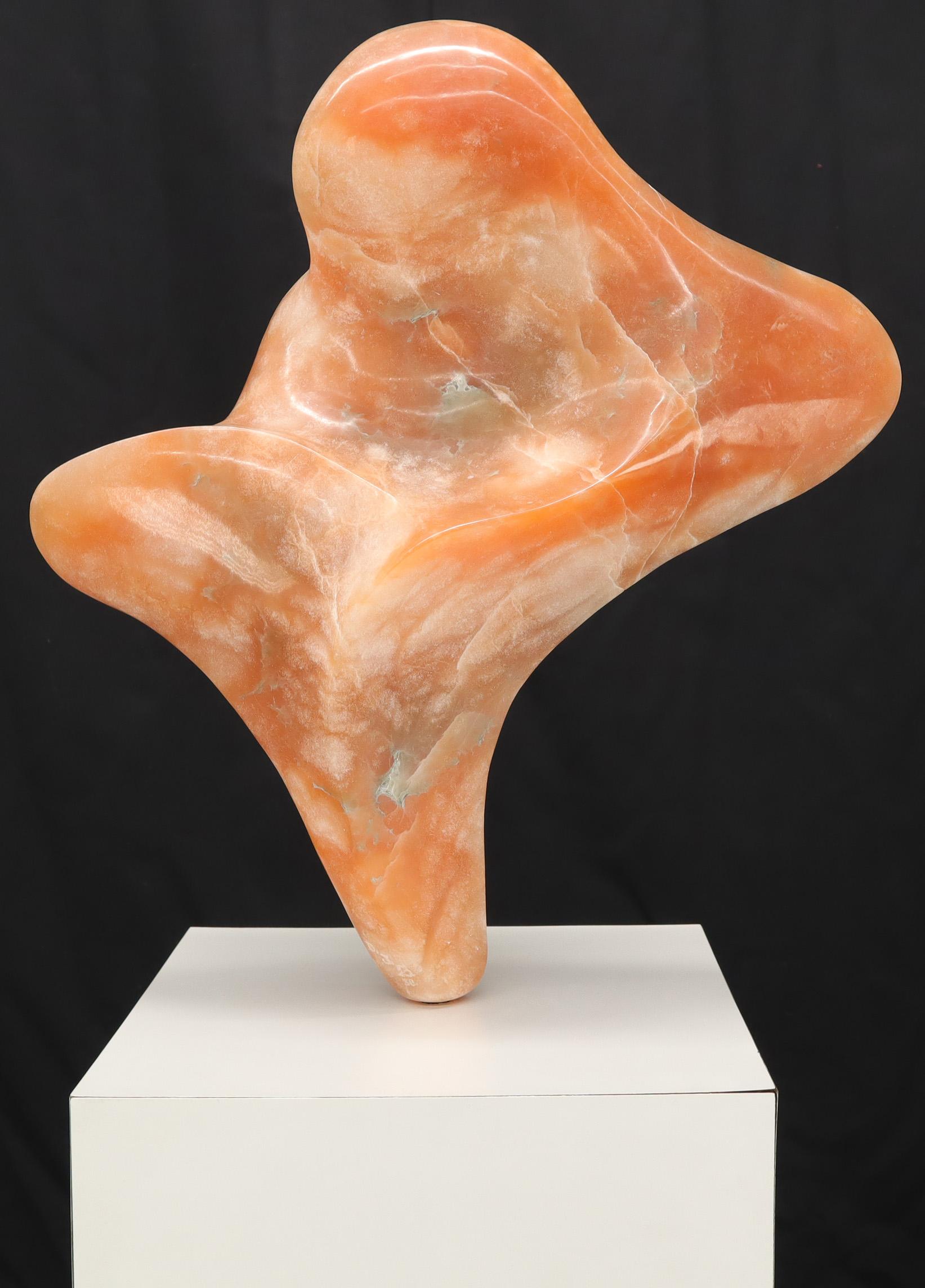 Modern abstract carved marble or onyx sculpture. Orange beige red.