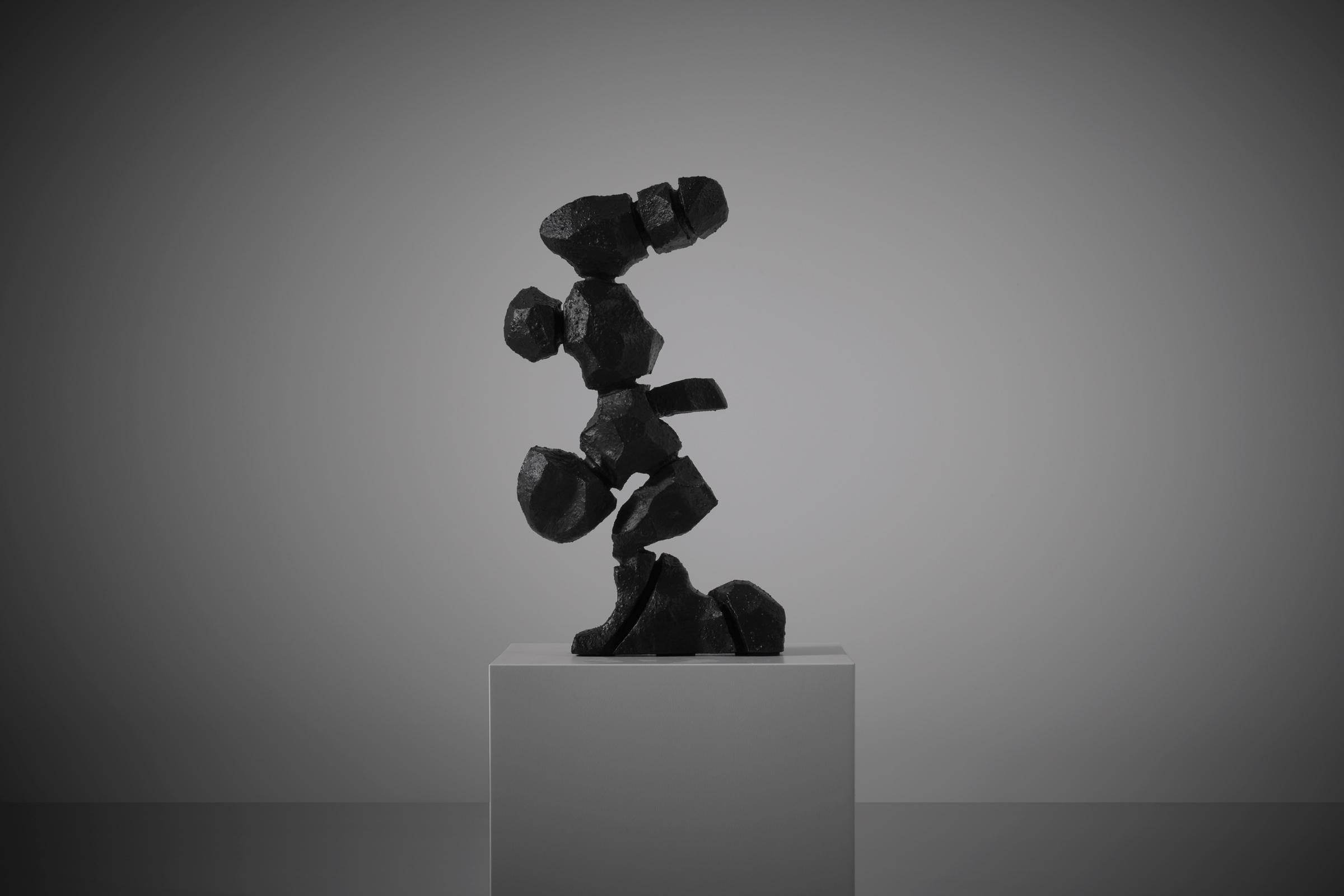 Abstract cast iron sculpture, Spain 1970s. The sculpture is made from heavy solid cast iron with a nice rough black stained structured surface. Interesting presentation of abstract cactus or eroded rocks shaped forms which are playing with the