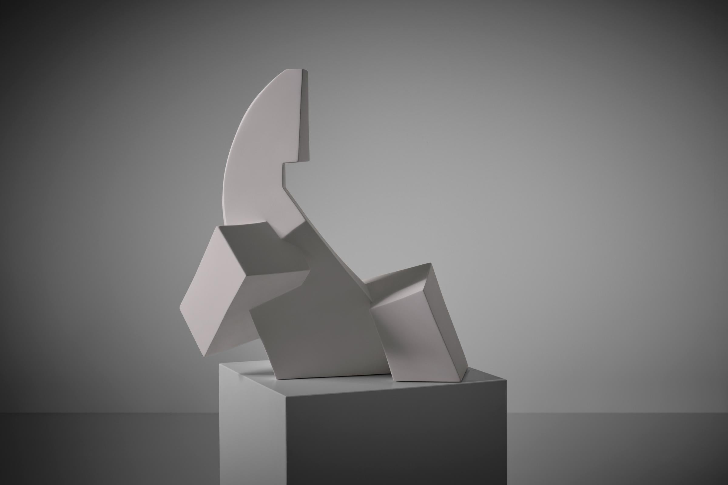 Large abstract cubistic sculpture, France 1960s. Strong cubistic shapes out of heavy solid plaster with a fine matte white surface. The refined architectural lines and cubistic forms catches the light from different angles and throw shadows on the