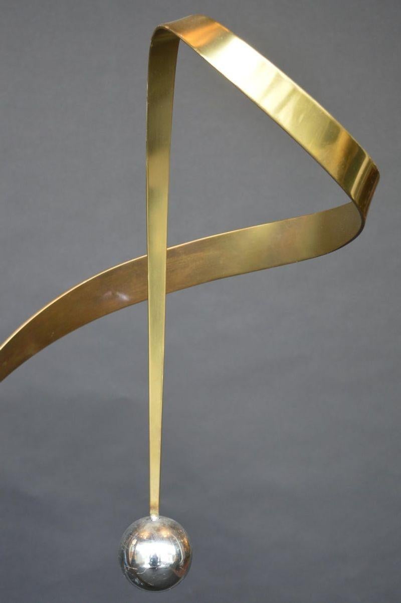 Abstract Curtis Jere sculpture. The body is made from brass and has a marble base.