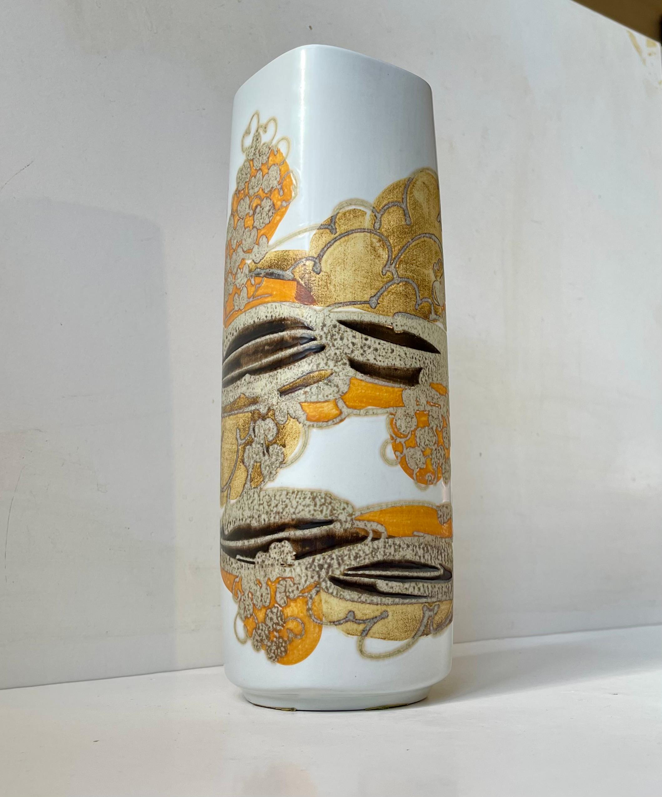 A tall fajance vase with abstract - modernistic glazed motif in contrasting yet earthy glazes. Designed by the danish ceramist Ellen Malmer (EM) and manufactured by Royal Copenhagen during the 1970s. Its fully signed, numbered and marked to the